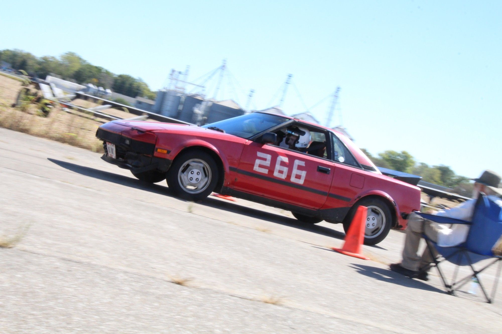 A first gen red Toyota MR-2.