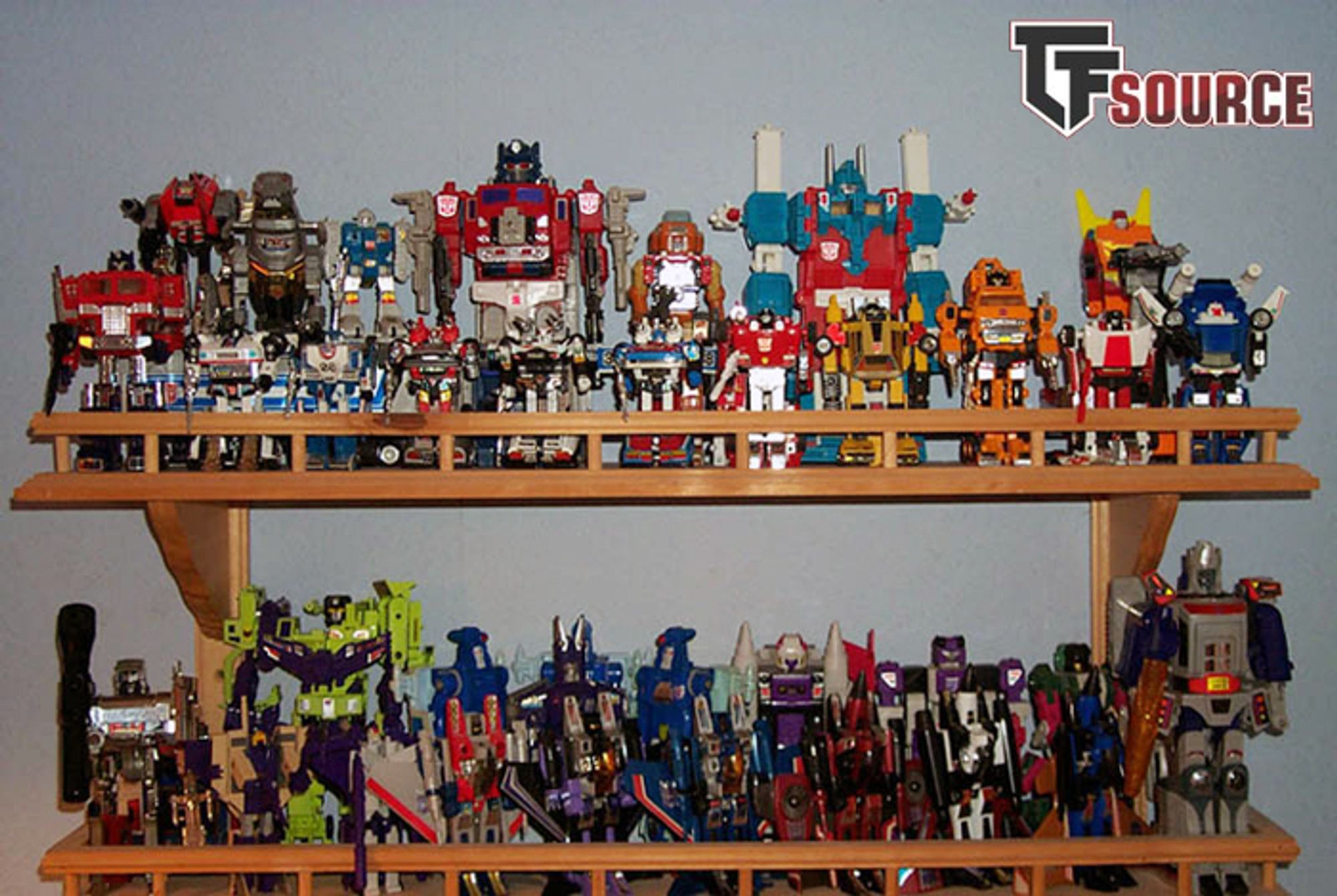 Wooden shelves containing nearly the entire G1 Transformer collection. Photo by TFSource