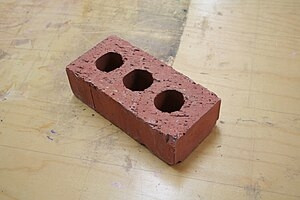 A brick that is, very clearly not a copper bar.