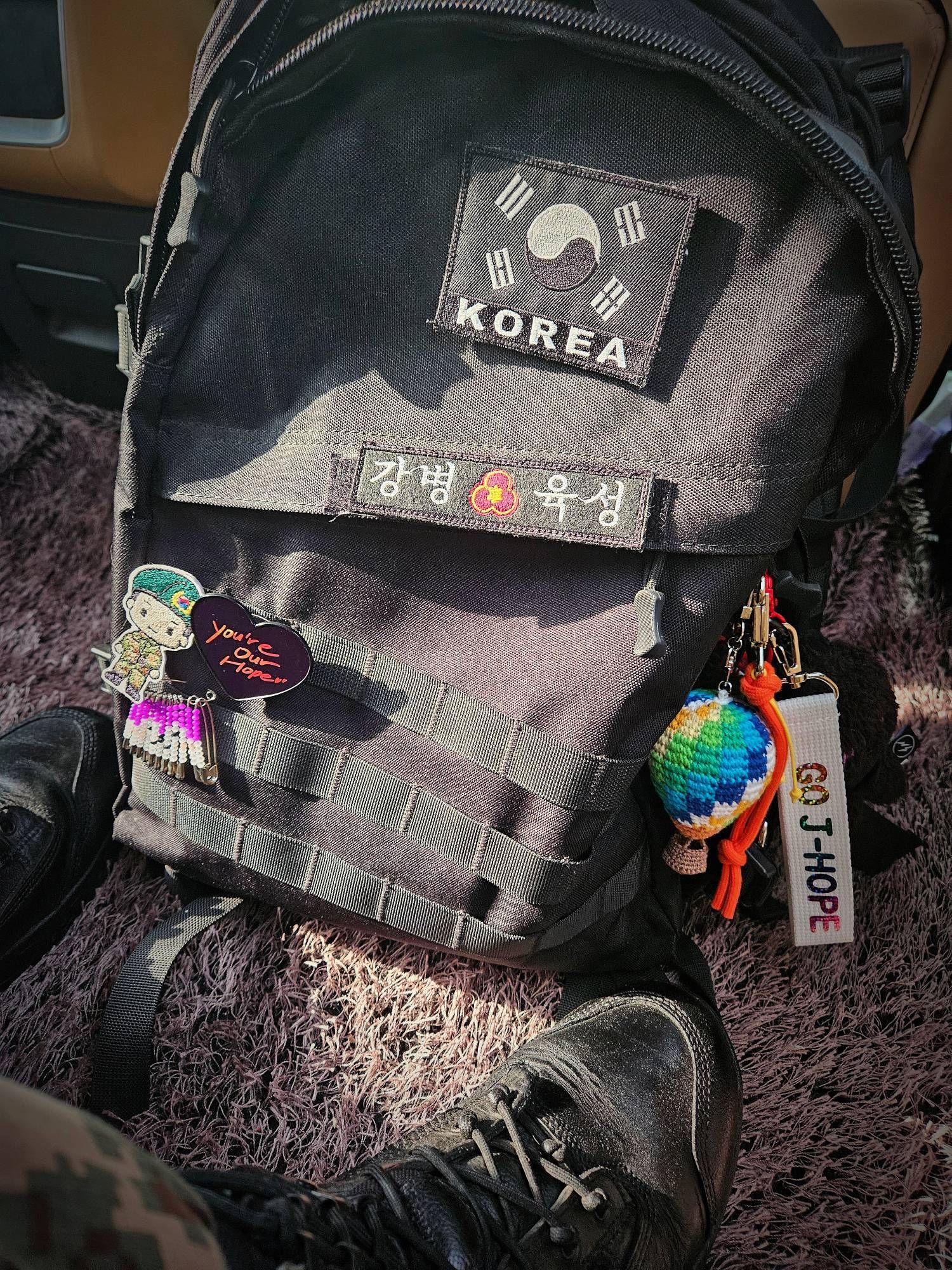 Hobi posted his backpack on instagram. Many BTS or J-Hope related keychains and patches are on it