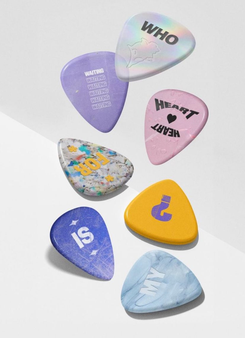 Colorful guitar picks as part of either promo or merch for Jimin's MUSE