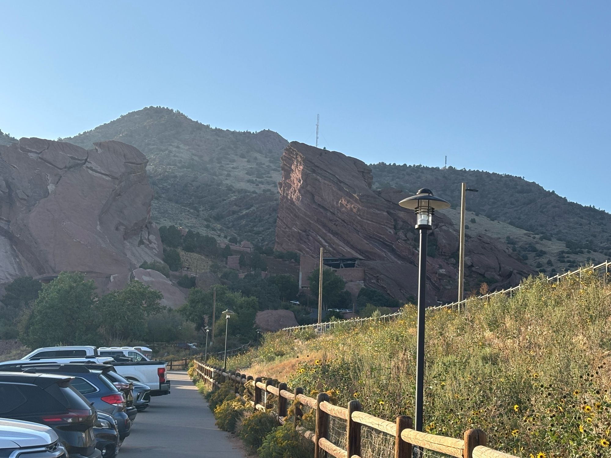 A near sunset view or Red Rock Amphitheater from a lower parking lot.