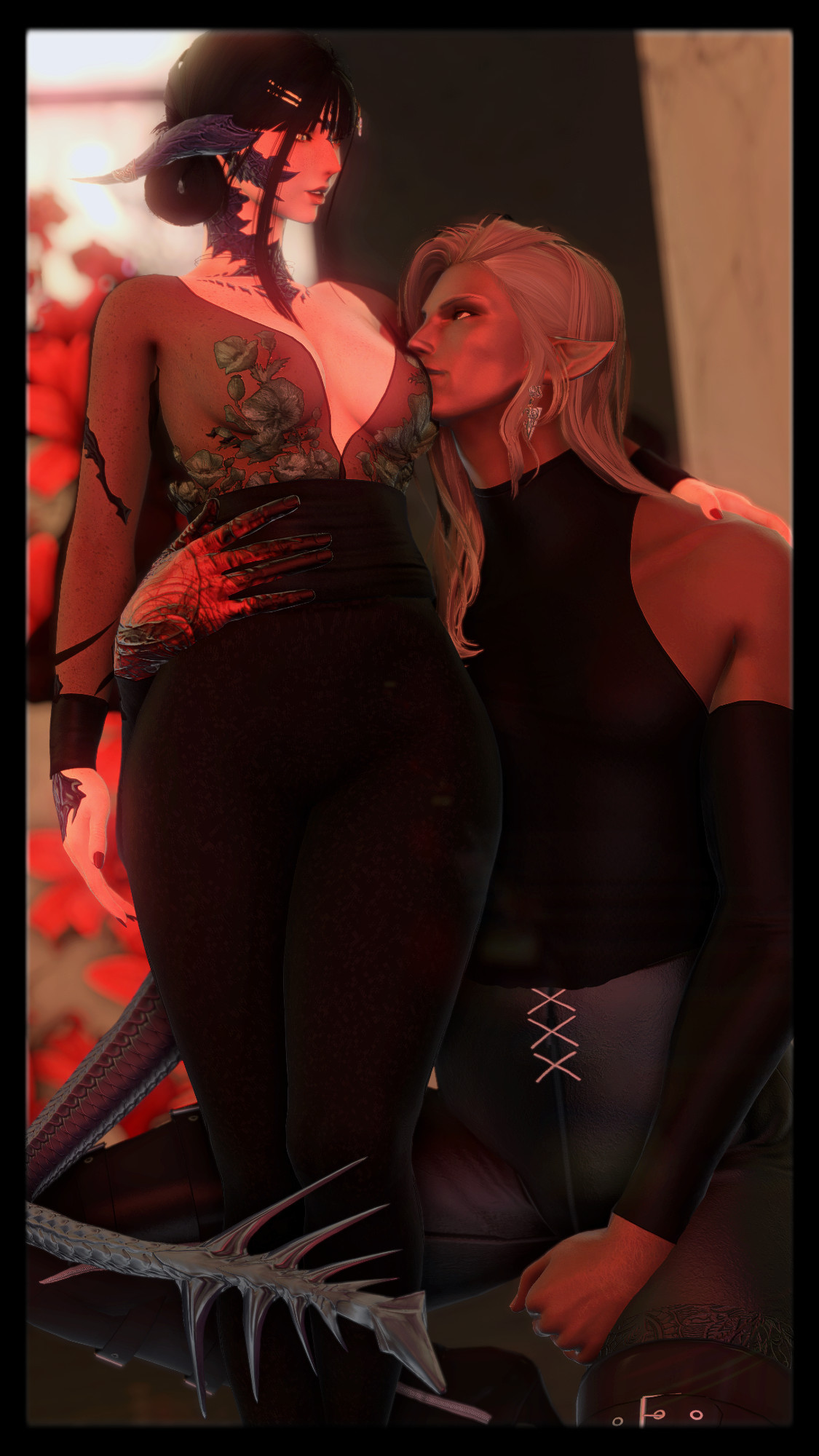 A screenshot from Final Fantasy 14. Khetya is an Au Ra Xaela with pale skin and dark hair, Val is an Elezen Duskwight with tan skin and blonde hair. Val is crouched to the ground to better match Khetya's height, with an arm wrapped around Khetya's waist. Khetya has one arm draped over Val's shoulder. They are wearing matching dark outfits with floral accents. They are looking at each other in a bi4bi (bisexual-for-bisexual) way.