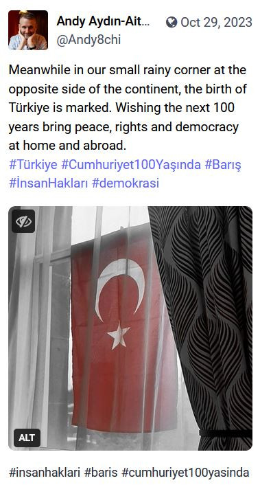 Post of Turkish flag hanging in a window, with wish for peace, rights and democracy