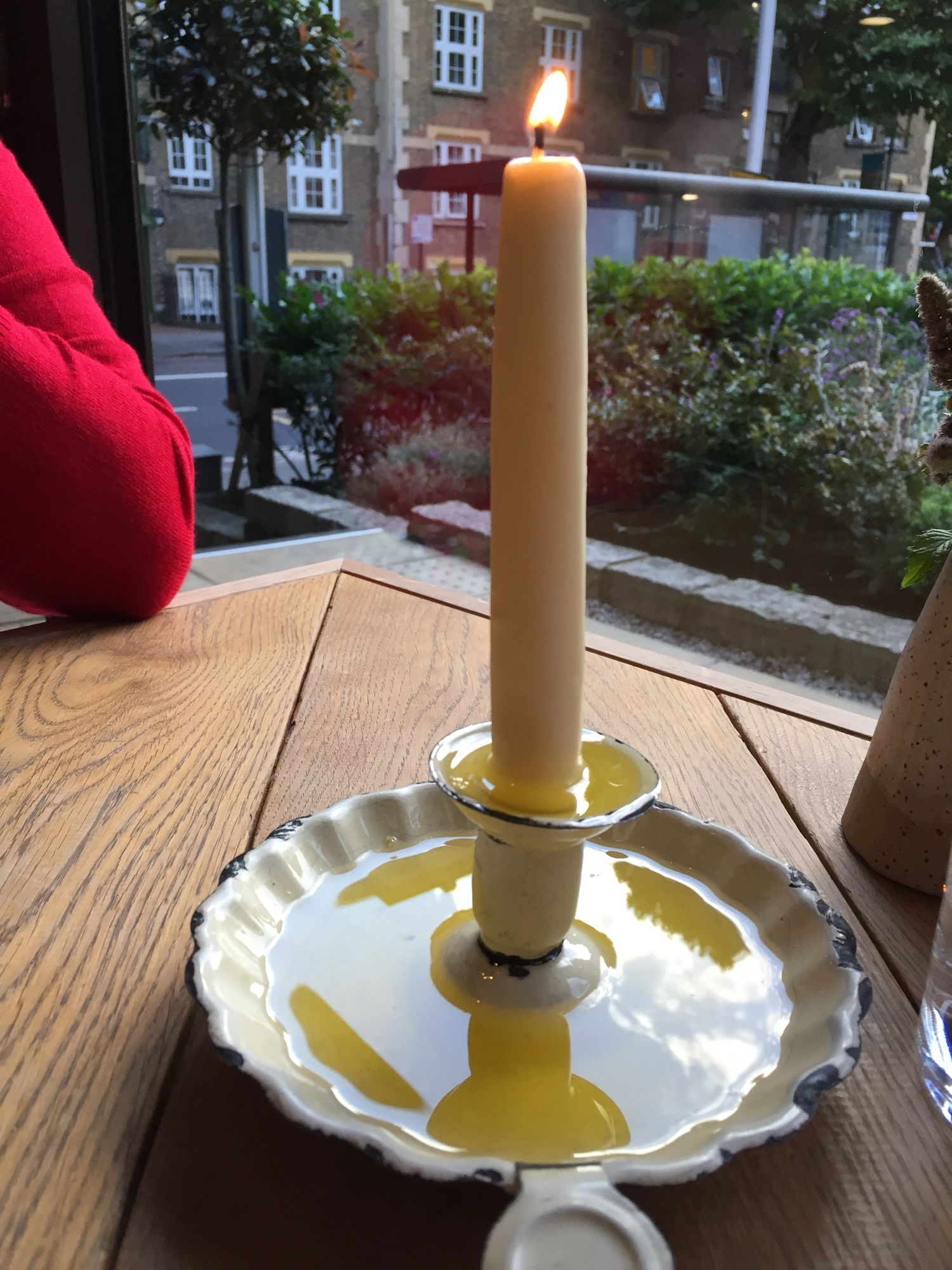 It just looks like a normal candle… until you notice the unusual tray it sits in, which is catching the drippings from the candle and making a little dipping pot