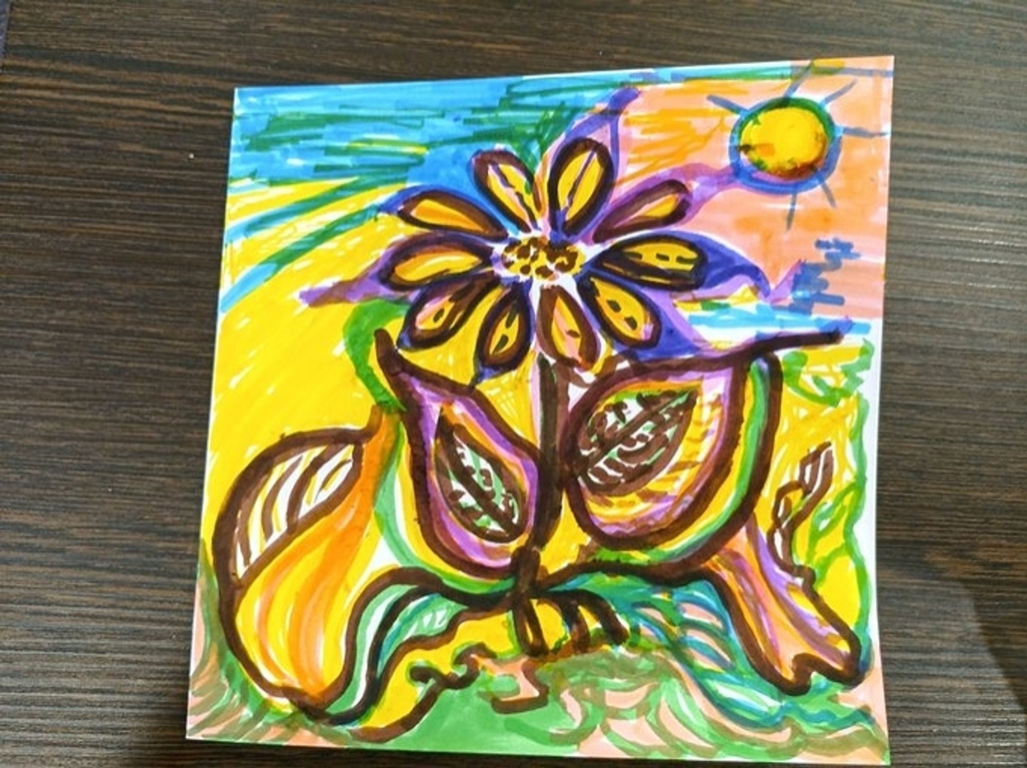 Image startd with a simple flower stencil but the resident continued to cover the card with colour.
There's a sun, water, soil and greenery aded.