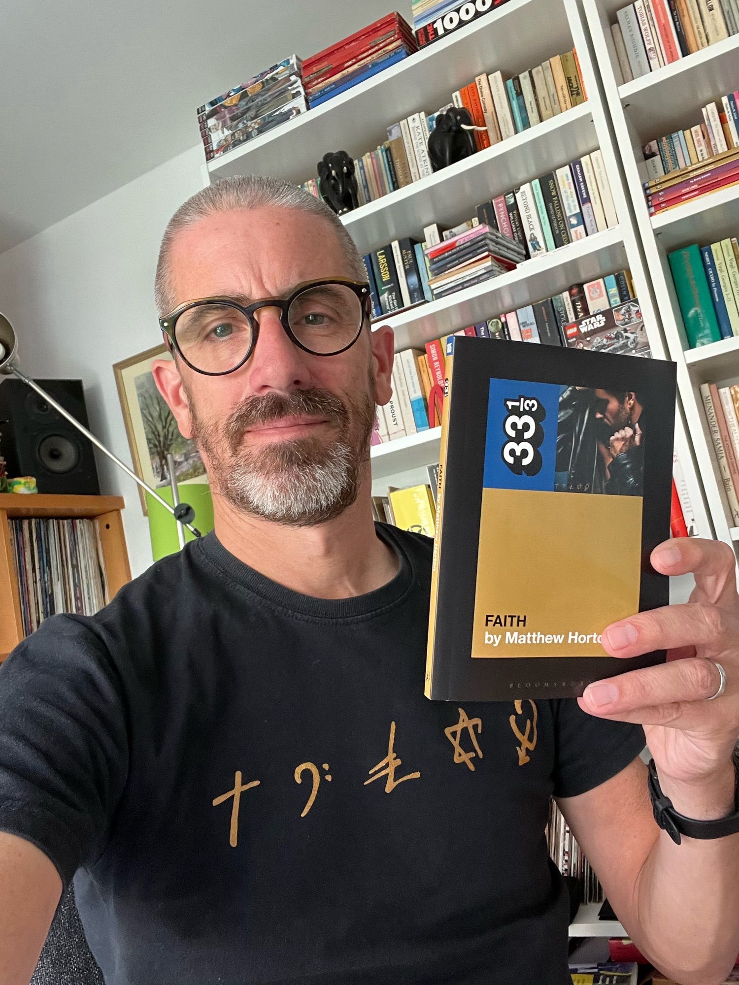 The author Matthew Horton with his 33 1/3 book on George Michael’s Faith.