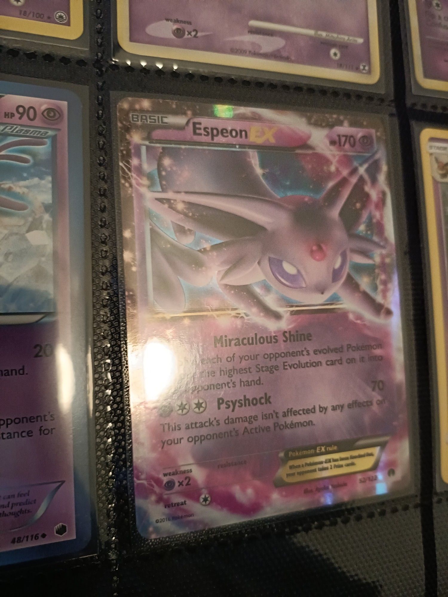 A Pokemon Card featuring Espeon