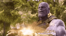 Thanos activating the infinity gauntlet 