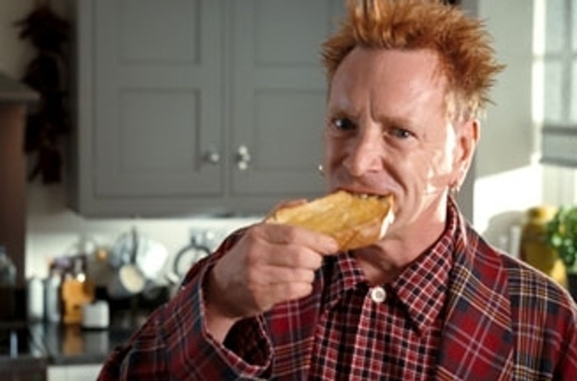 A washed up Johnny rotten in the country life butter add from the 00's