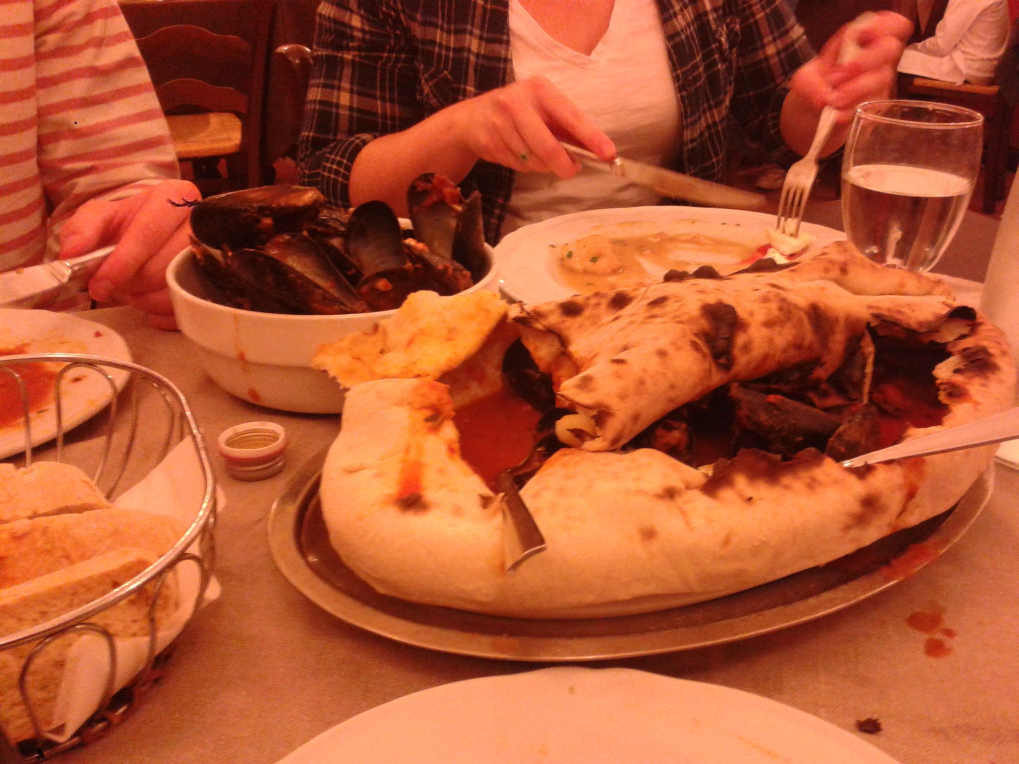 the 'zuppa di cozze' at donna fortunatas in motta st anastasia, mussels in tomato sauce baked/steamed inside a thing of bread, may 2015 (object is in the upper left quadrant)