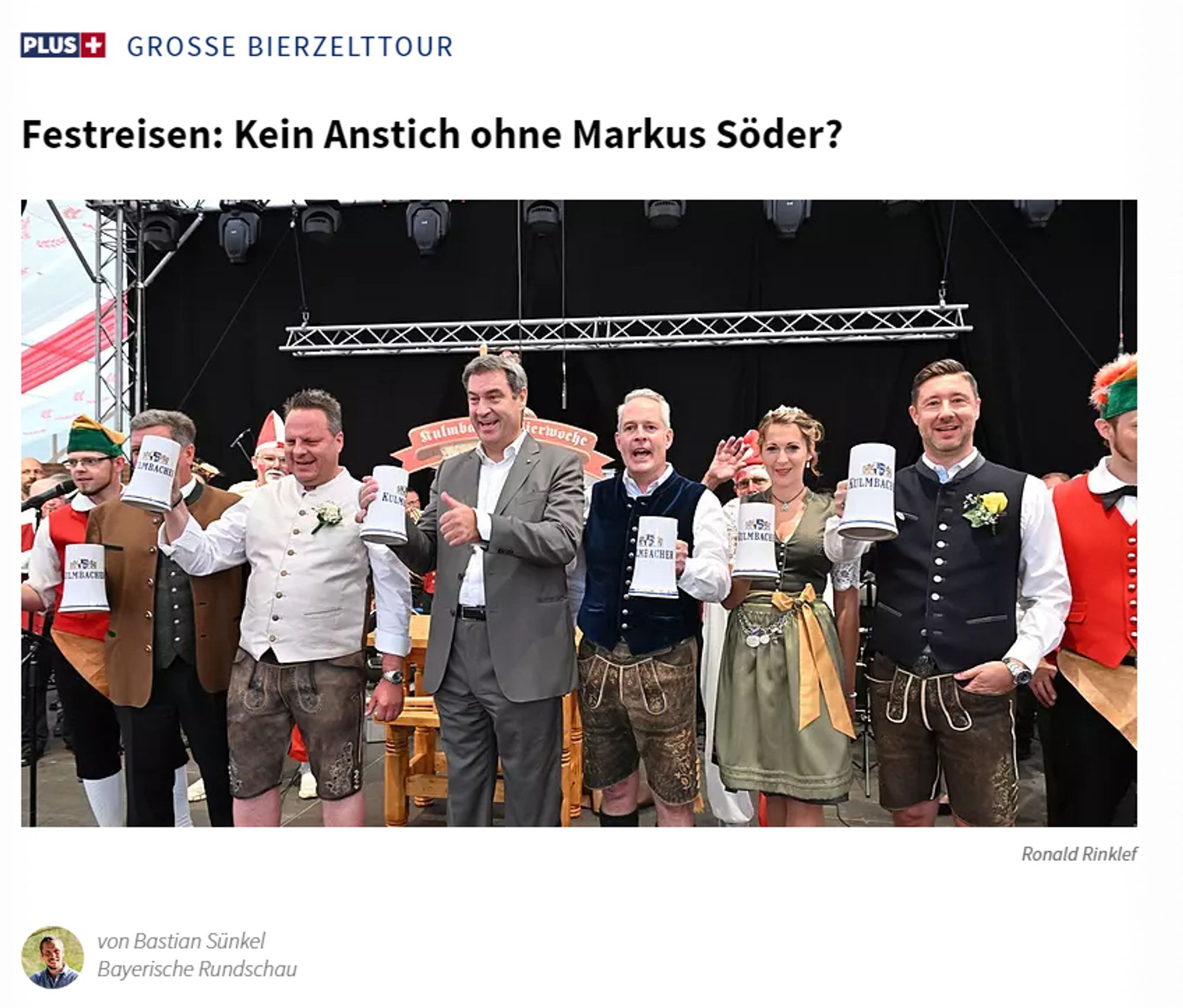 Zeitungsausschnitt. Abbildung: Söder mit Maßkrug in der Hand in einem Bierzelt. Überschrift: Grosse Bierzelttour - Festreisen: Kein Anstich ohne Markus Söder?