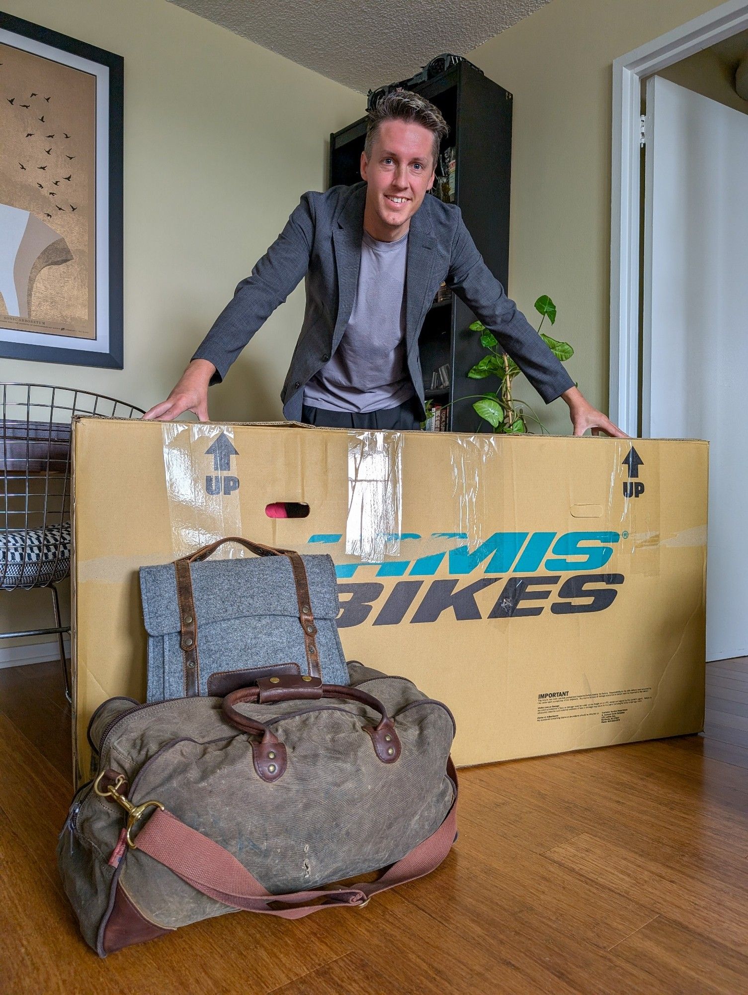 Person with bike box and luggage