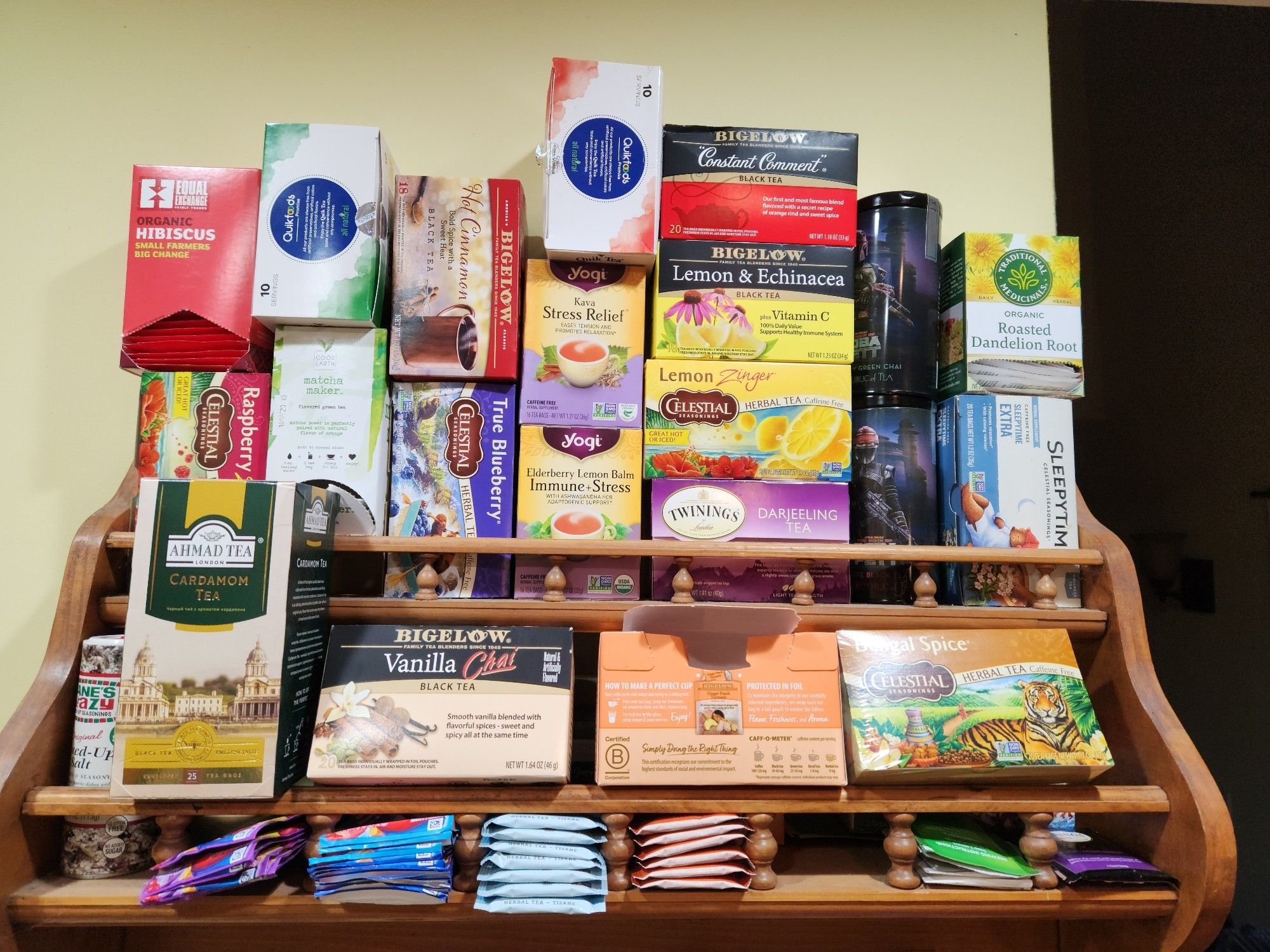 A photo of a hanging wall shelf completely full of boxes of teas from many different companies. Herbal, black, green, fruity, spicy,... you name it we got it!