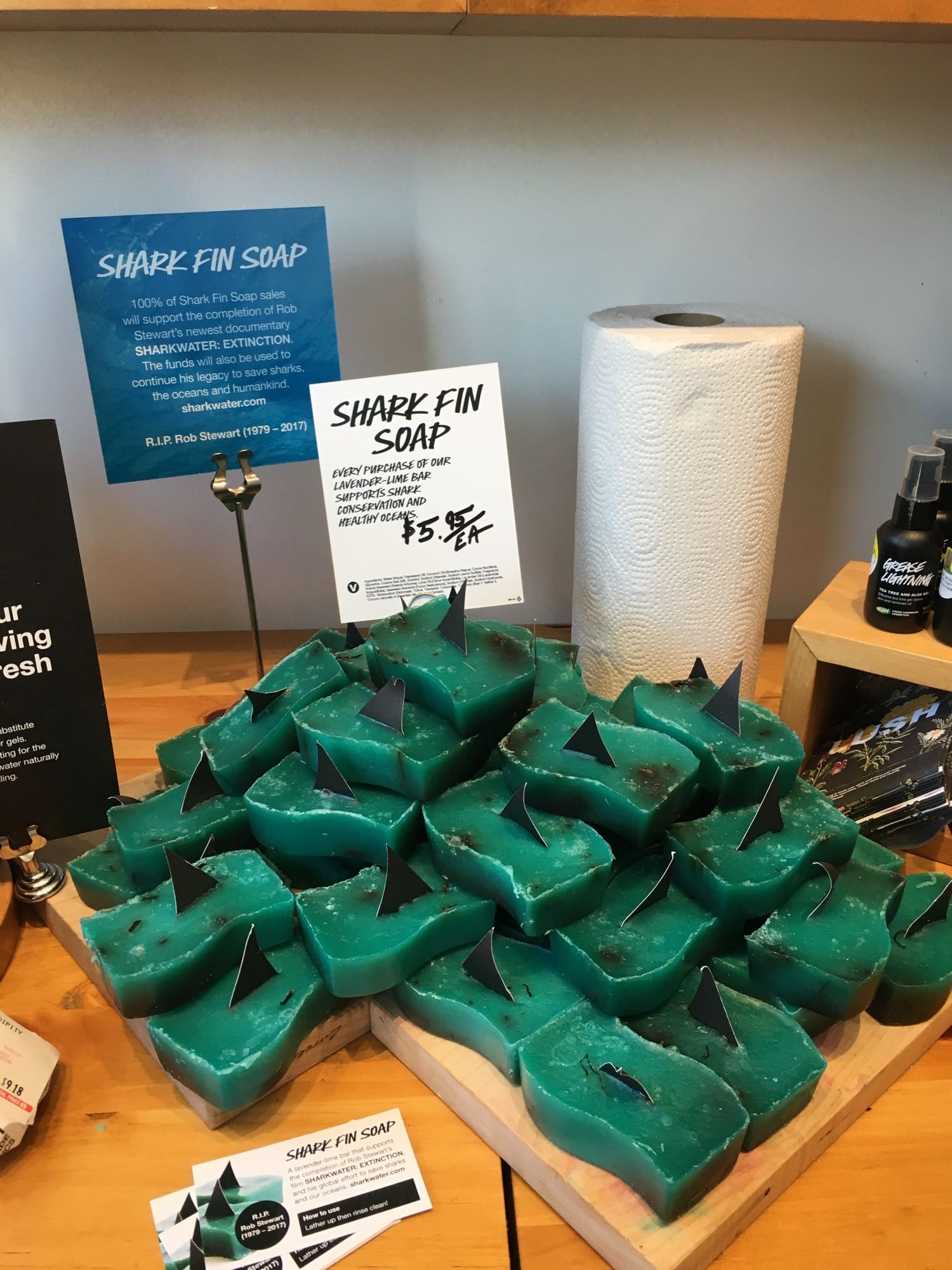 A pile of “Shark Fin Soap”, blue-green soap bars with a shark fin decoration at Lush Cosmetics.