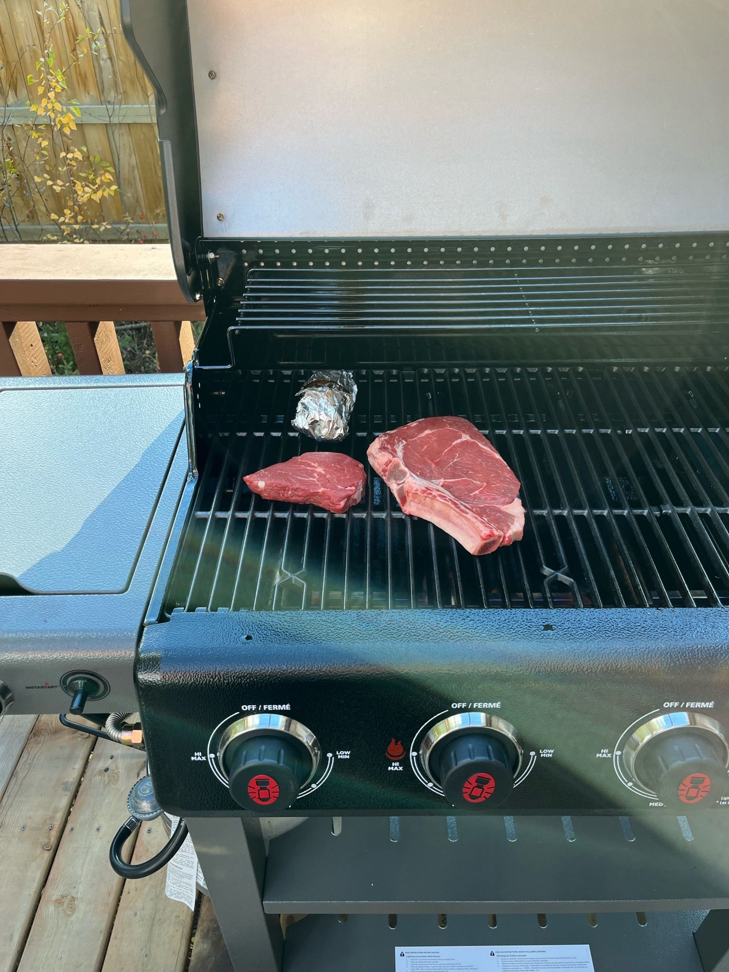 Steaks on a barbecue.