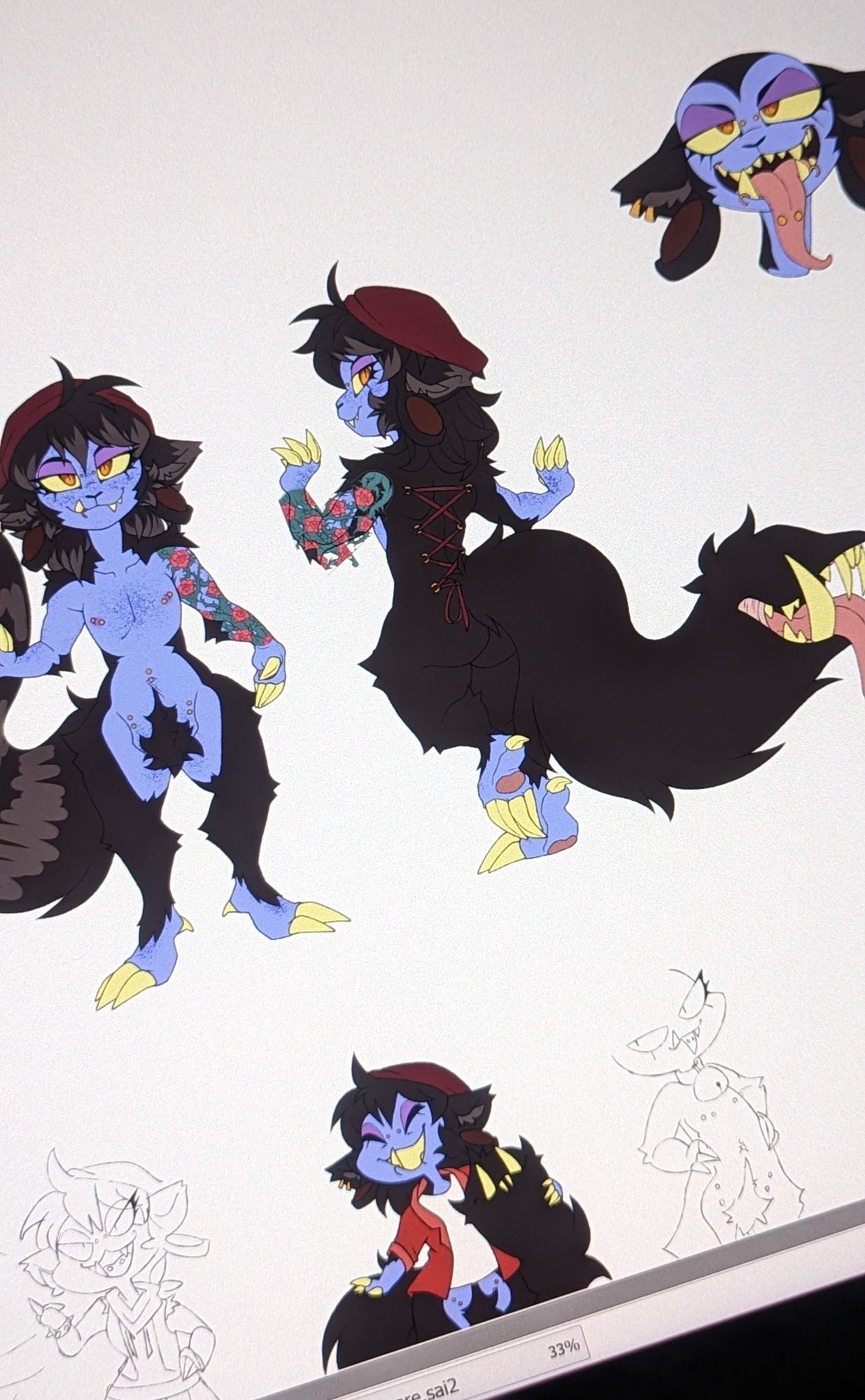 a slanted photo of a tablet screen showing multiple unfinished drawings of a black and blue tailmouth cat character