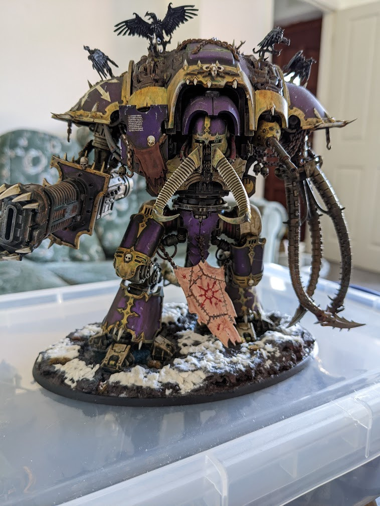 A photo of a big scary Chaos Knight in a lovely purple and gold colour scheme.