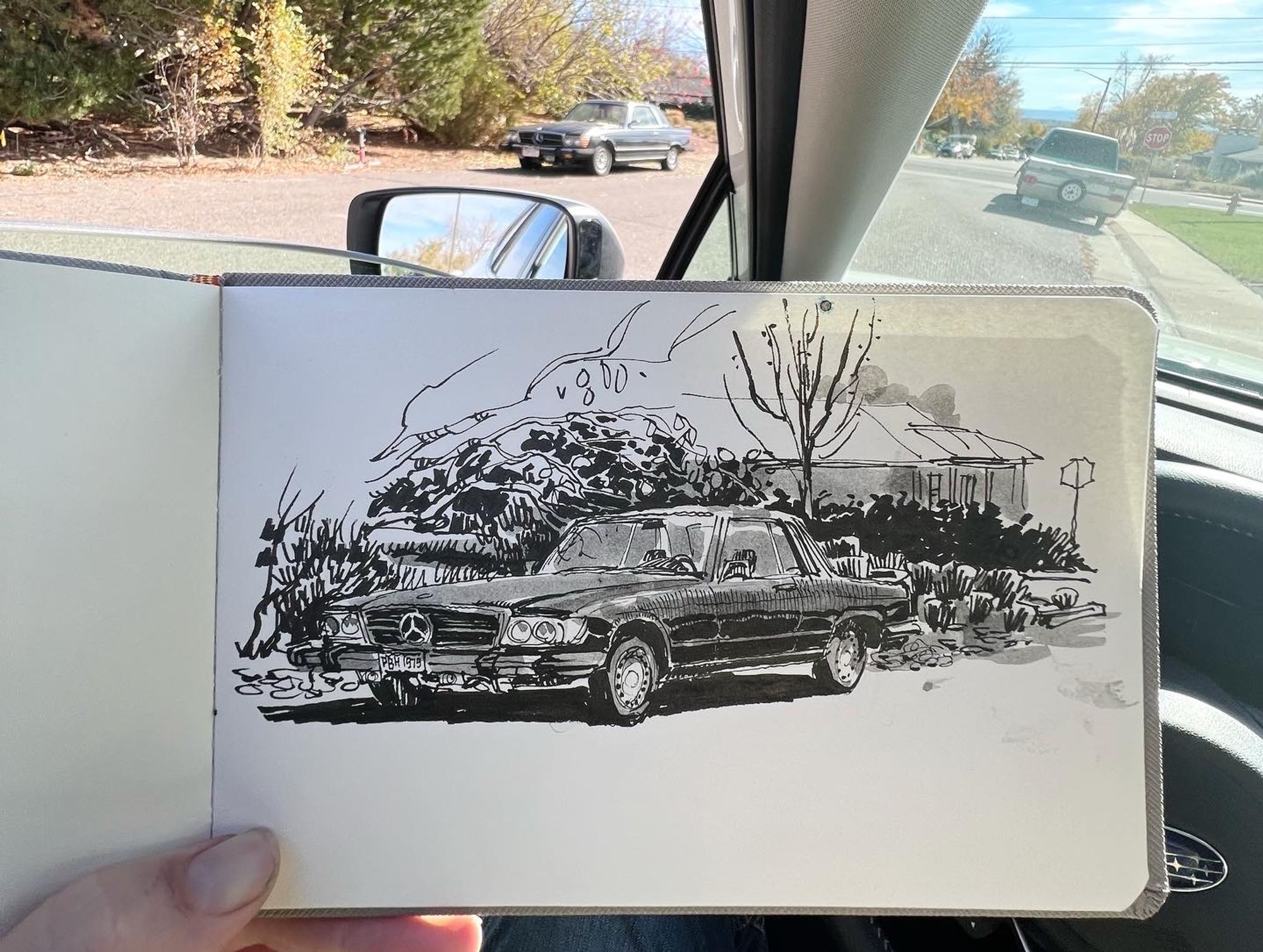 Pen and ink sketch of a Mercedes Benz parked on a residential street 