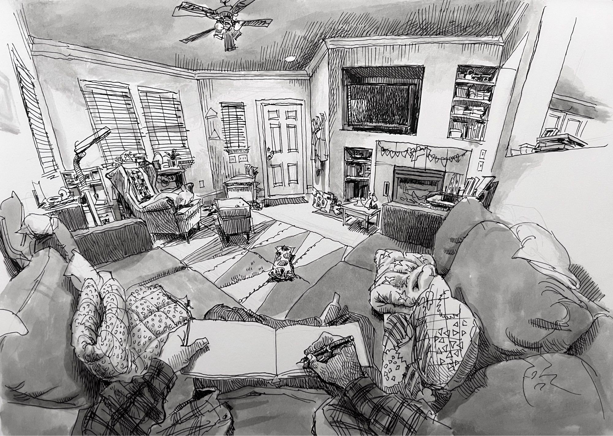 black and white pen and ink sketch of a living room from the artist’s point of view, showing the room and the artist’s hands and sketchbook in the act of sketching the room