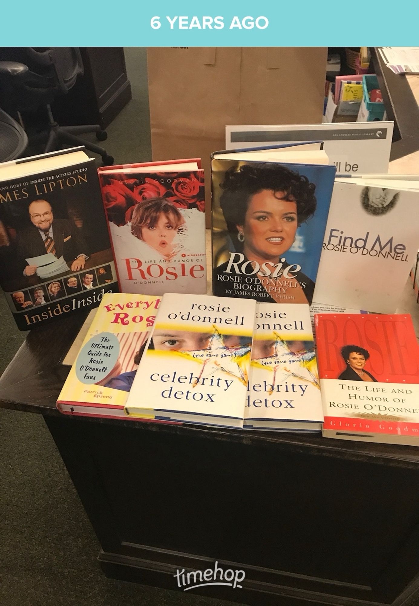 A photo of a ton of books, most of them are various books about Rosie O'Donnell (either written by her or about her), and one book by James Lipton.