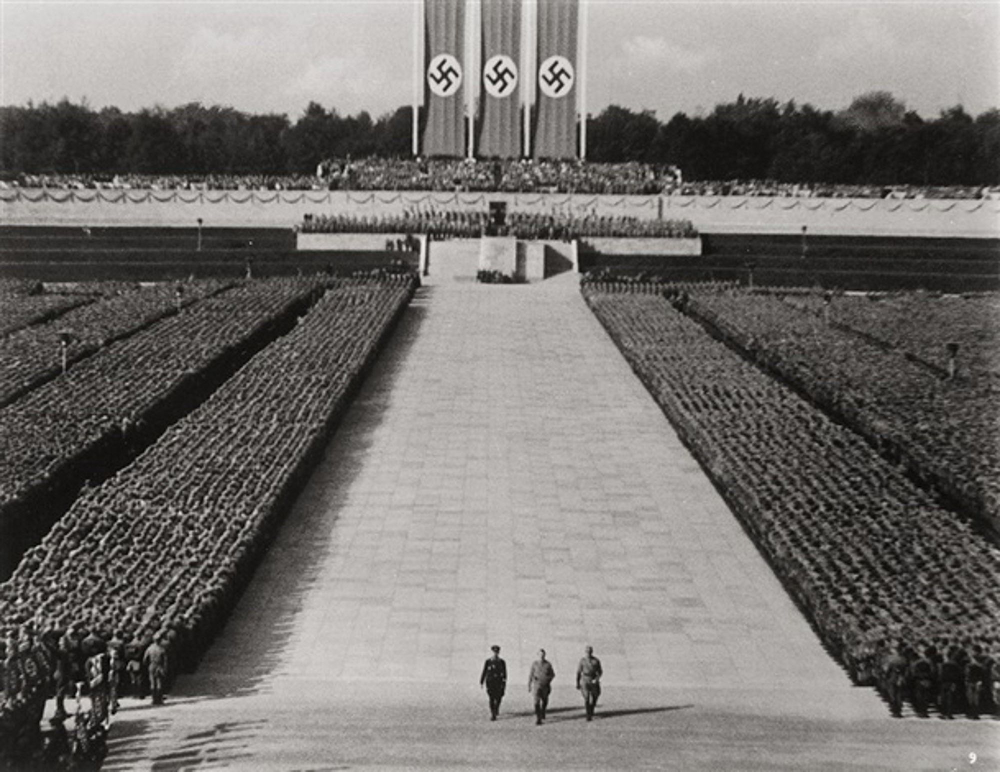 Still from Leni Riefenstahl: Triumpf des Willens as an example of a fascist square with flags and soldiers in formation