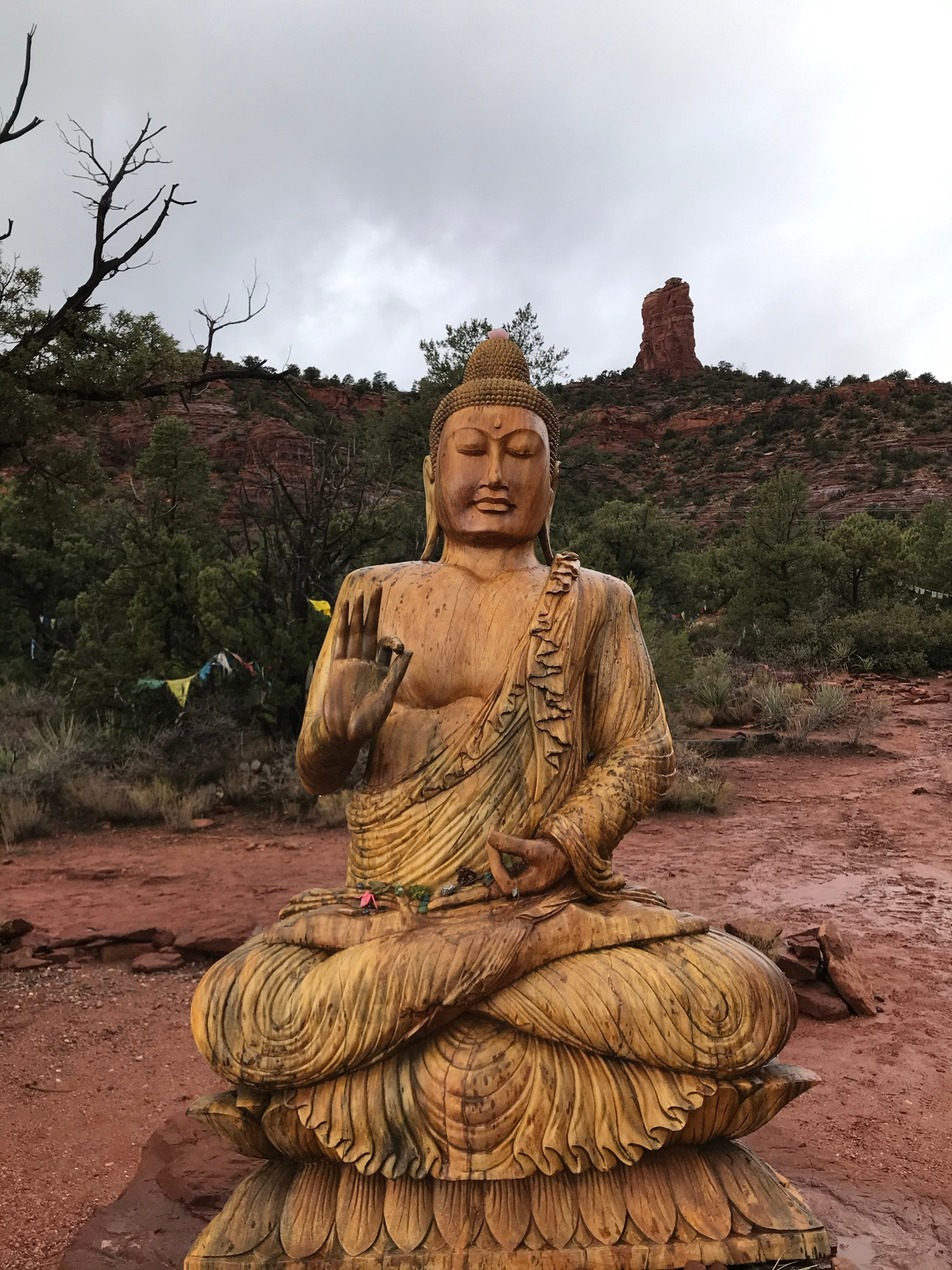 Amitabha Stupa Buddha, sitting with legs, crossed one hand and lap, and one hand up in Sedona.