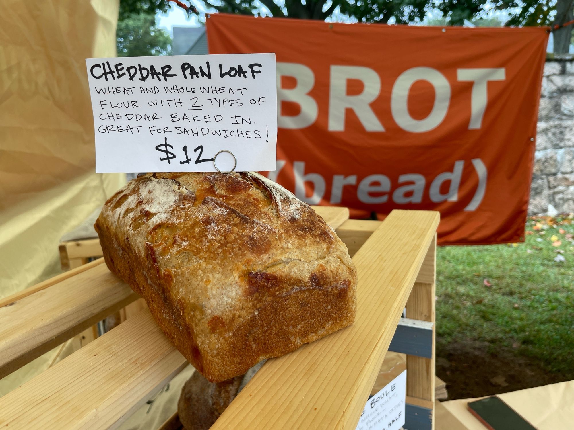 A lonely loaf of cheddar sourdough bread- captured in the wild before purchase.