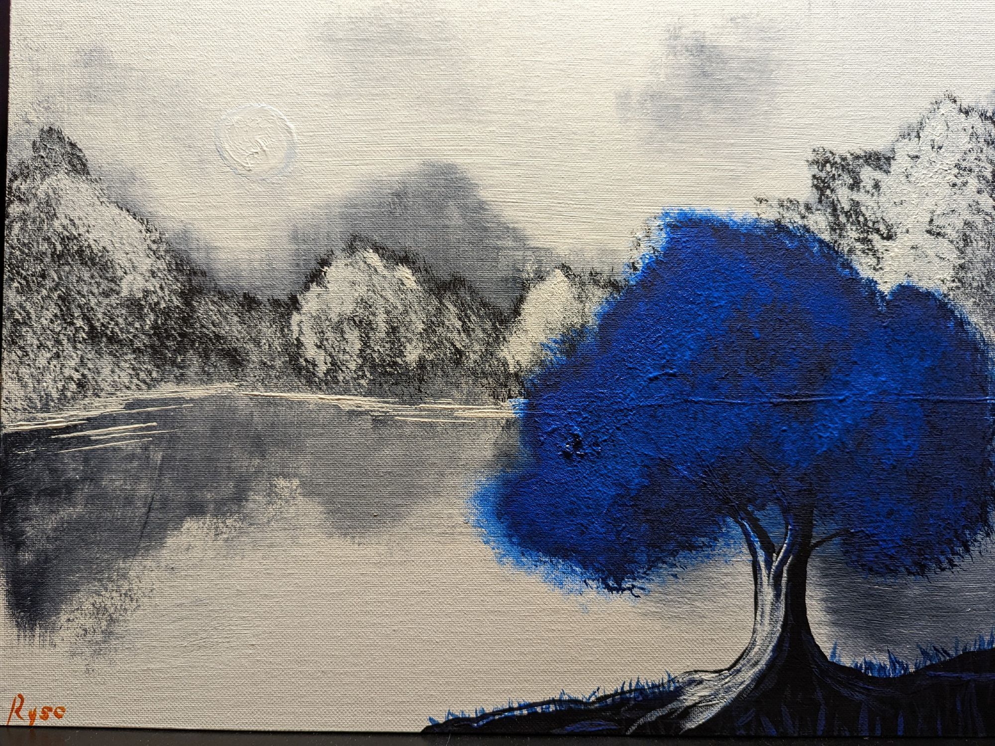 black and white painting of a large lake and trees in the background with a single blue tree on the closest shore.