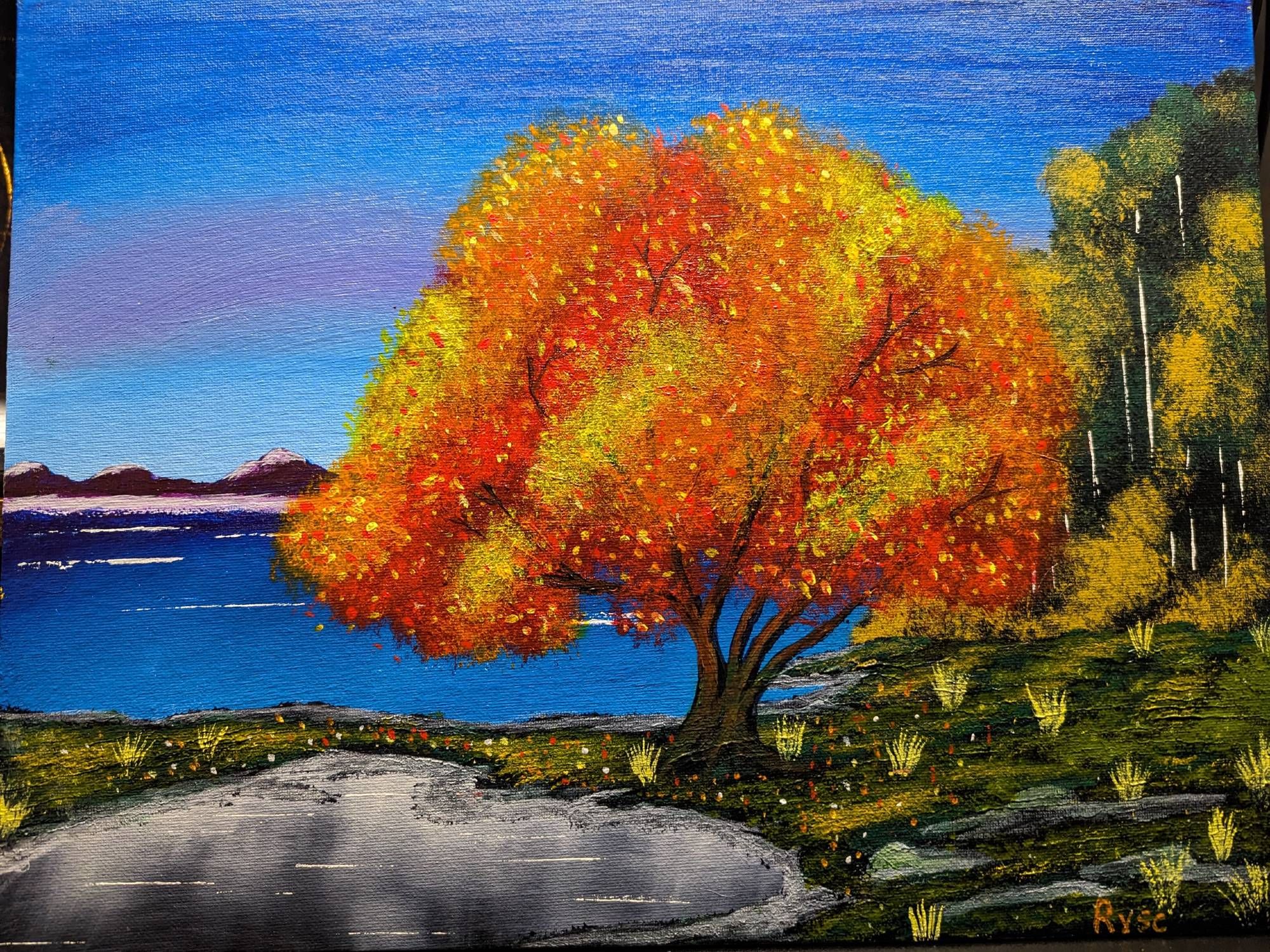 acrylic painting of a crisp fall day over a lake with a tree covered in falls gold, orange, and gold leaves.