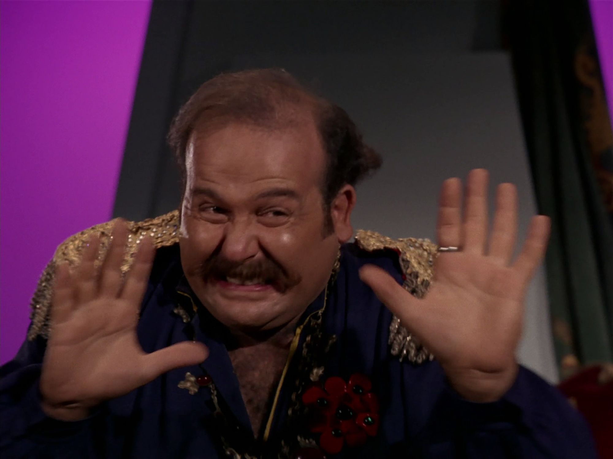 STAR TREK Screencap: Harry Mudd, cringing because it's going to happen anyway.