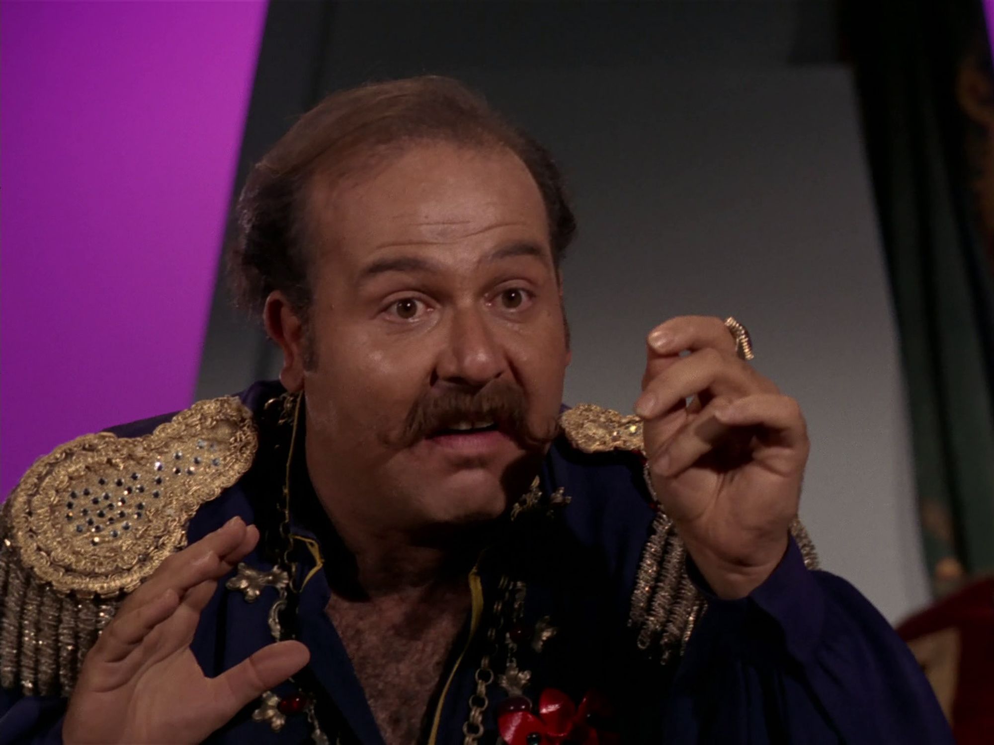 STAR TREK Screencap: Harry Mudd, pausing at what he's just heard.