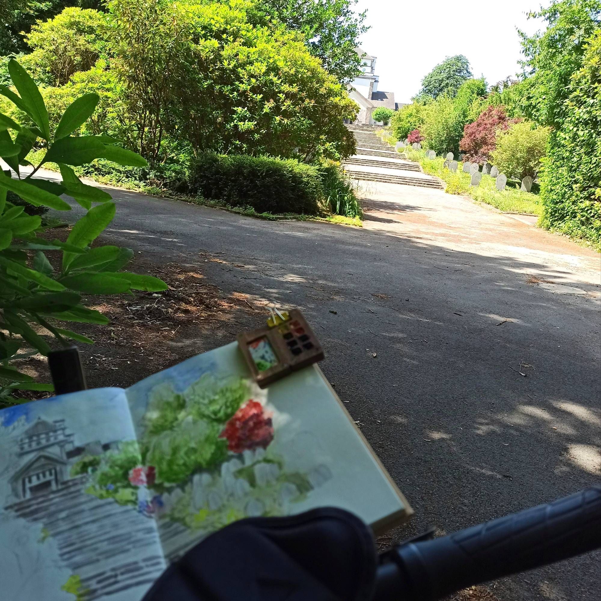 Sketchbook on my bike in front of the stairs.