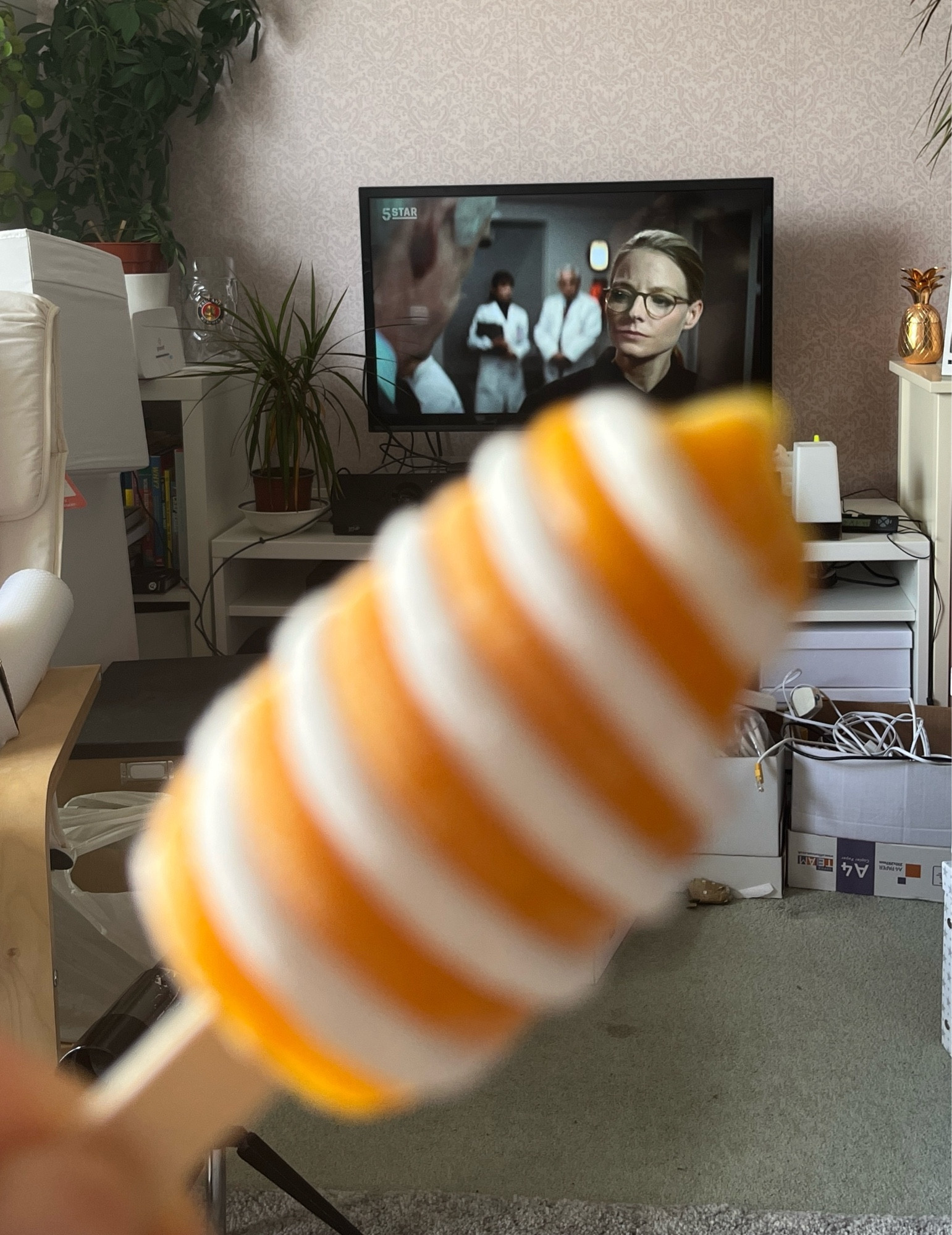 Me sat eating a twister ice lolly with a Jodie Foster film on in the background