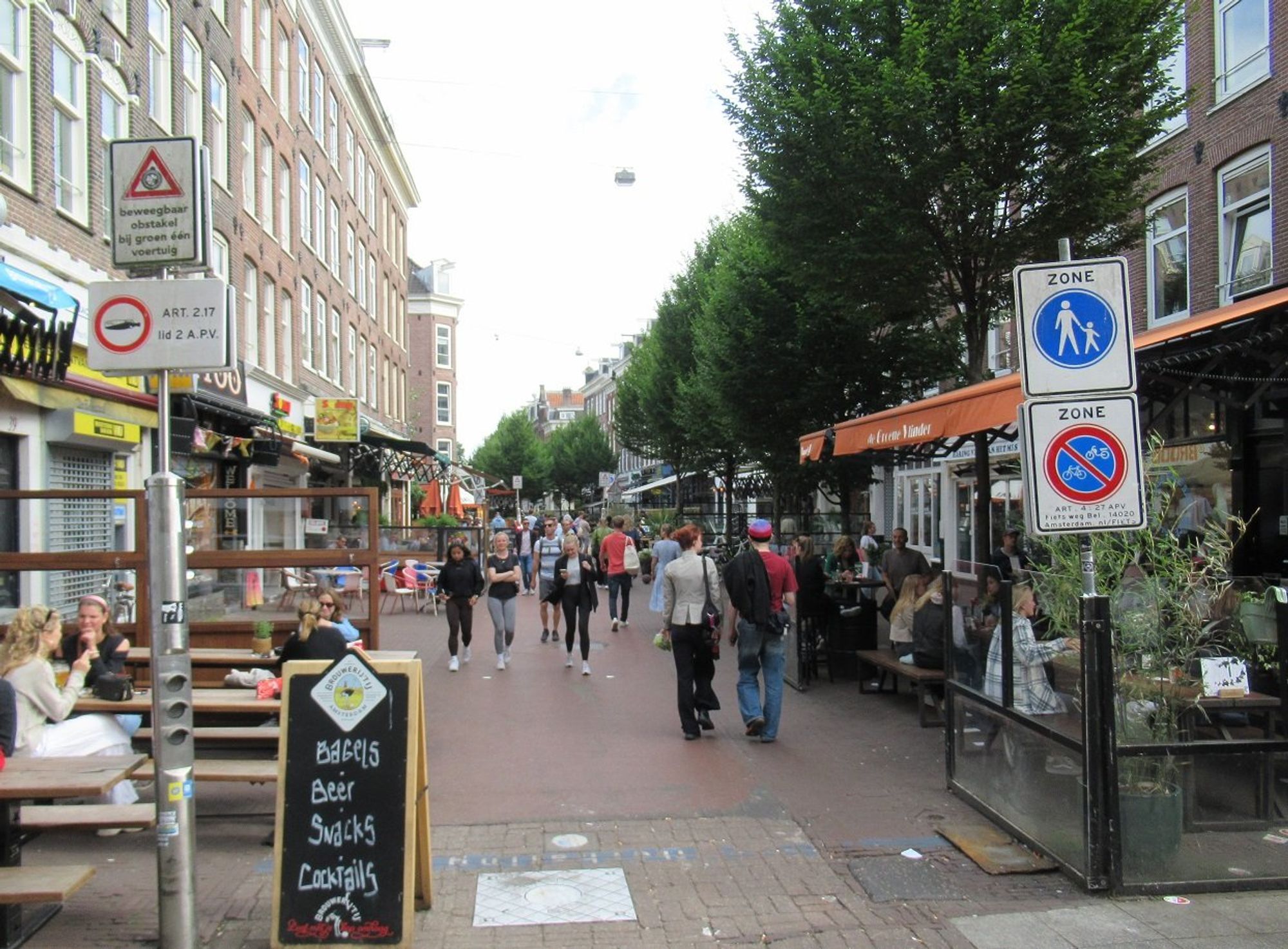 Color photo of the same street fully pedestrianized, vibrant- full of people, cafes, and businesses .

File under: Urbanism, bike, walk,