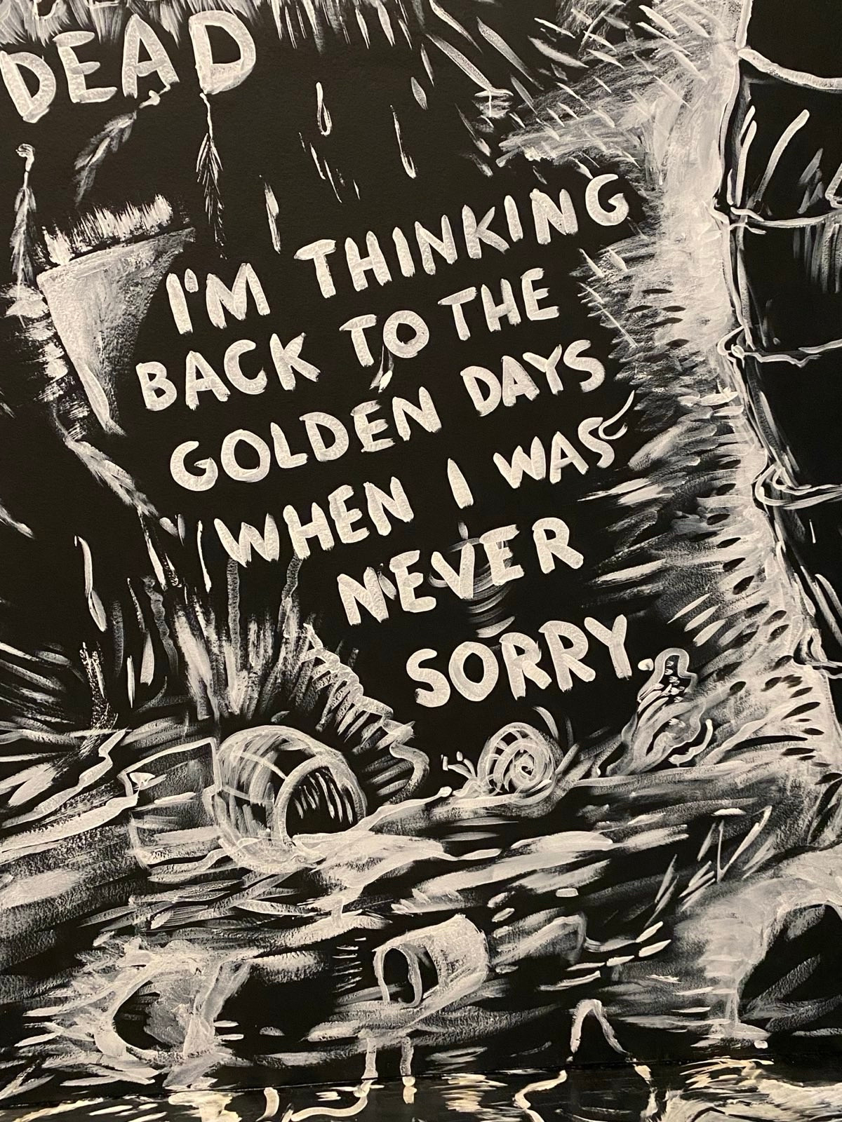 A graphic black and white avant-garde piece with these words 
DEAD
I'M THINKING BACK TO THE GOLDEN DAYS / WHEN I WAS
NEVER
SORRY

Laurie Anderson, The Four Talks exhibit, Hirshhorn Museum. 