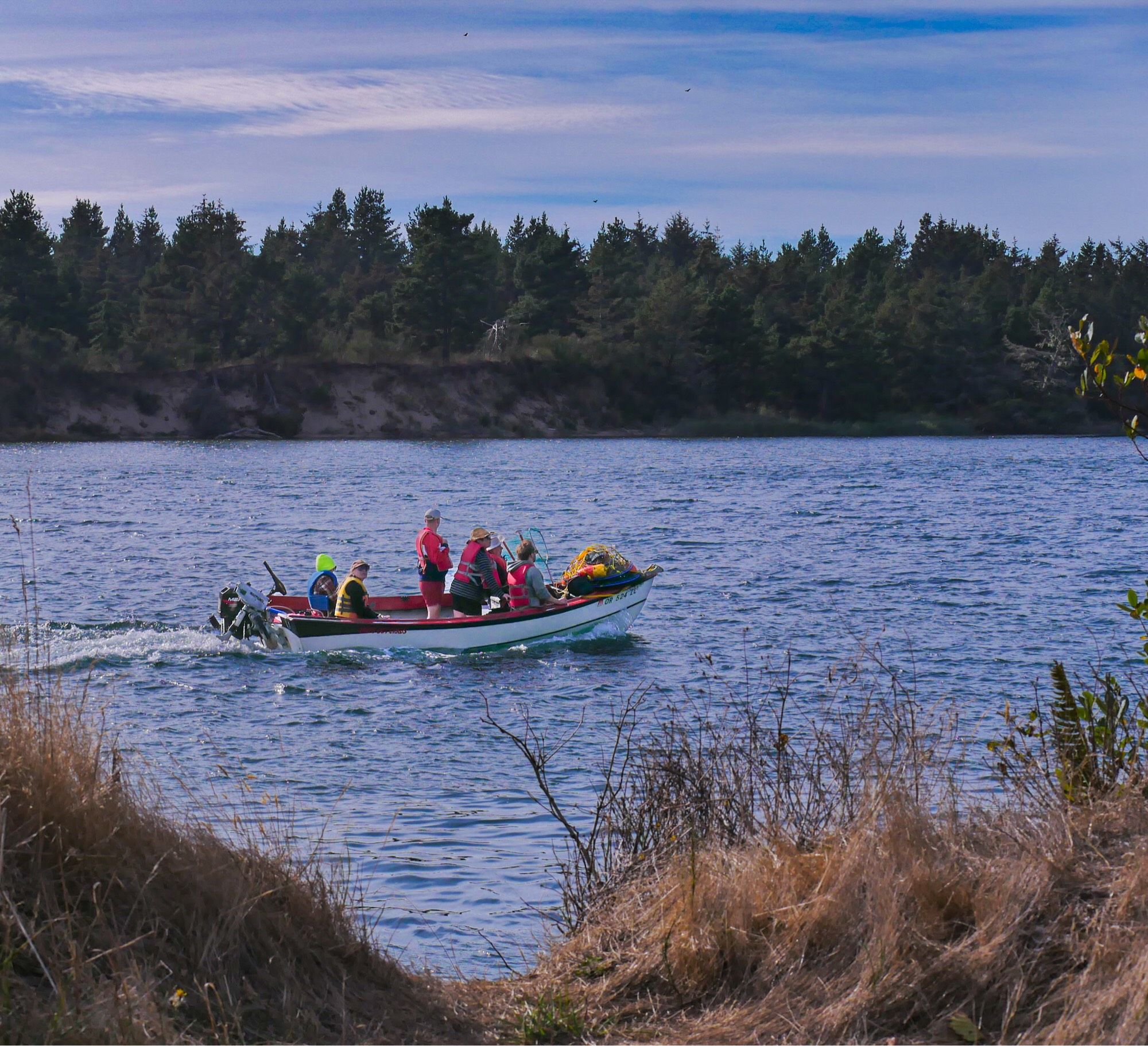 Loaded family boat returning from crab netting session.