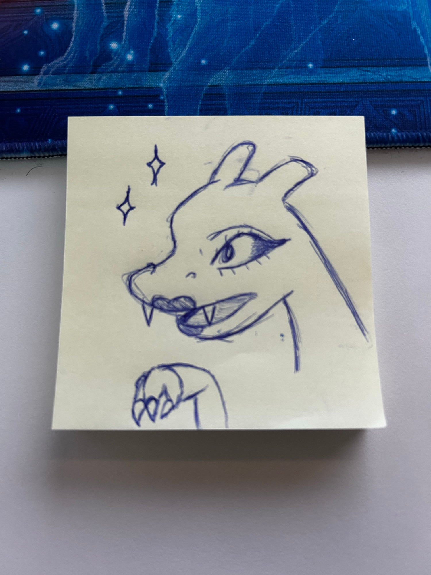 Post-it note doodle of the Pokemon Charizard. She has eye make-up and lip stick. 💅🏻 
