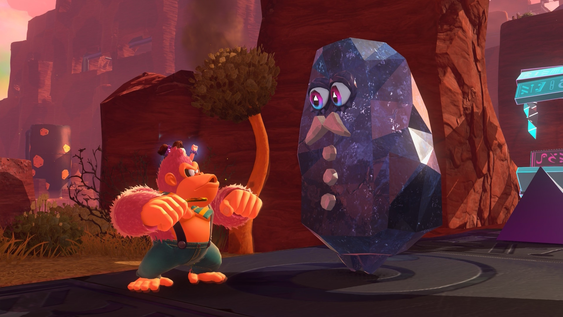 Screenshot from Donkey Kong Bananza. Donkey Kong is standing next to a rock with a mustache. 