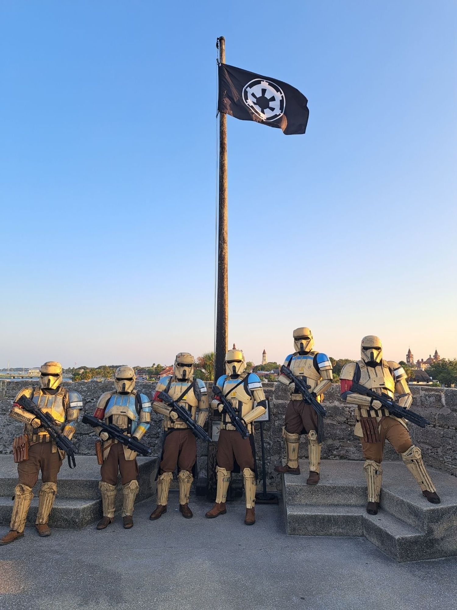 501st Legion Florida Garrison shoretrooper squad standing beneath the Imperial flag after the Empire successfully invaded the Castillo de San Marcos in St Augustine, FL on August 17, 2024.