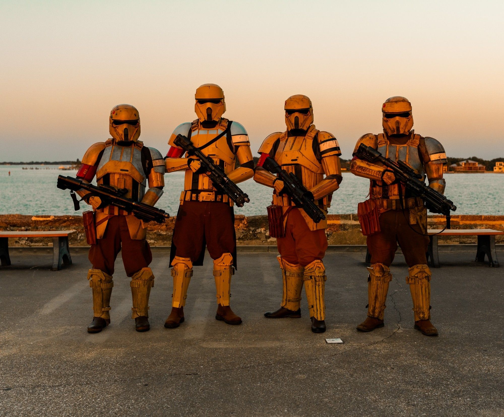 501stlegion Florida Garrison Imperial invasion of the Castillo de San Marcos in St Augustine, FL on August 17, 2024.  This is a picture of four shoretroopers on top of the fortress with the Matanzas inlet and Atlantic Ocean in the background.  The golden light is from the setting sun.  On the left and right are two captains (I'm on the left). Next to me is a squad leader and next to him is a grunt.