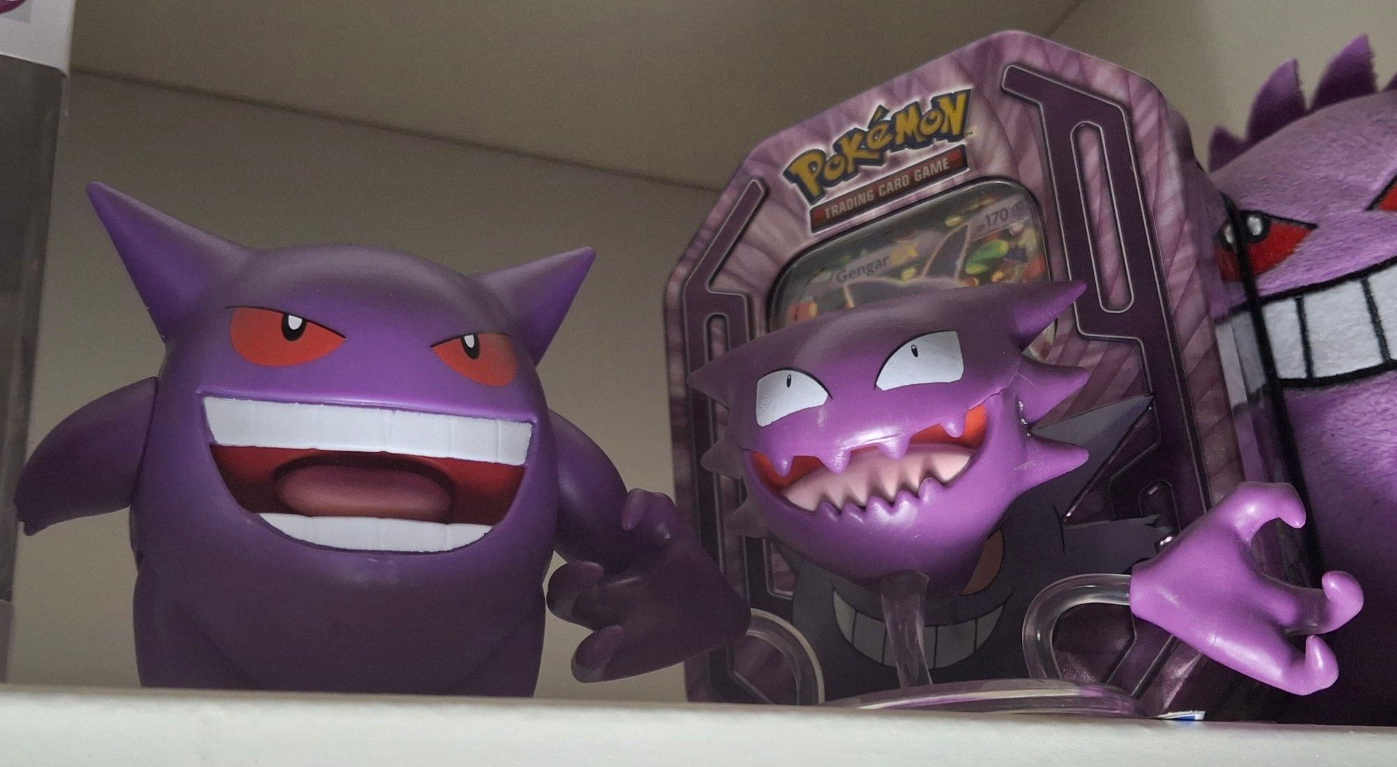 Two figures of the ghost-type Pokémon Gengar and Haunter.