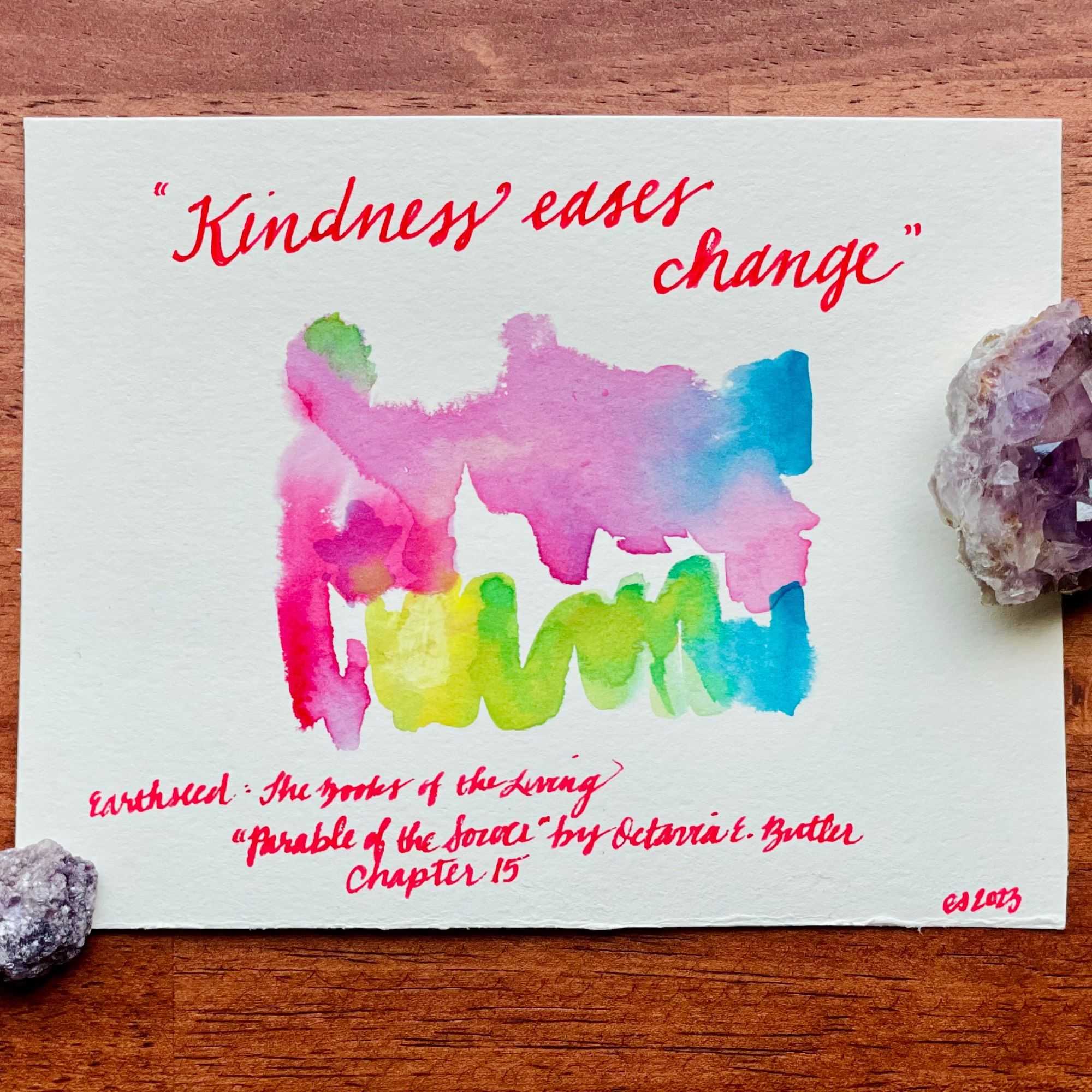 A painting with the words “Kindness eases change.” - from Parable of the Sower, by Octavia E. Butler 