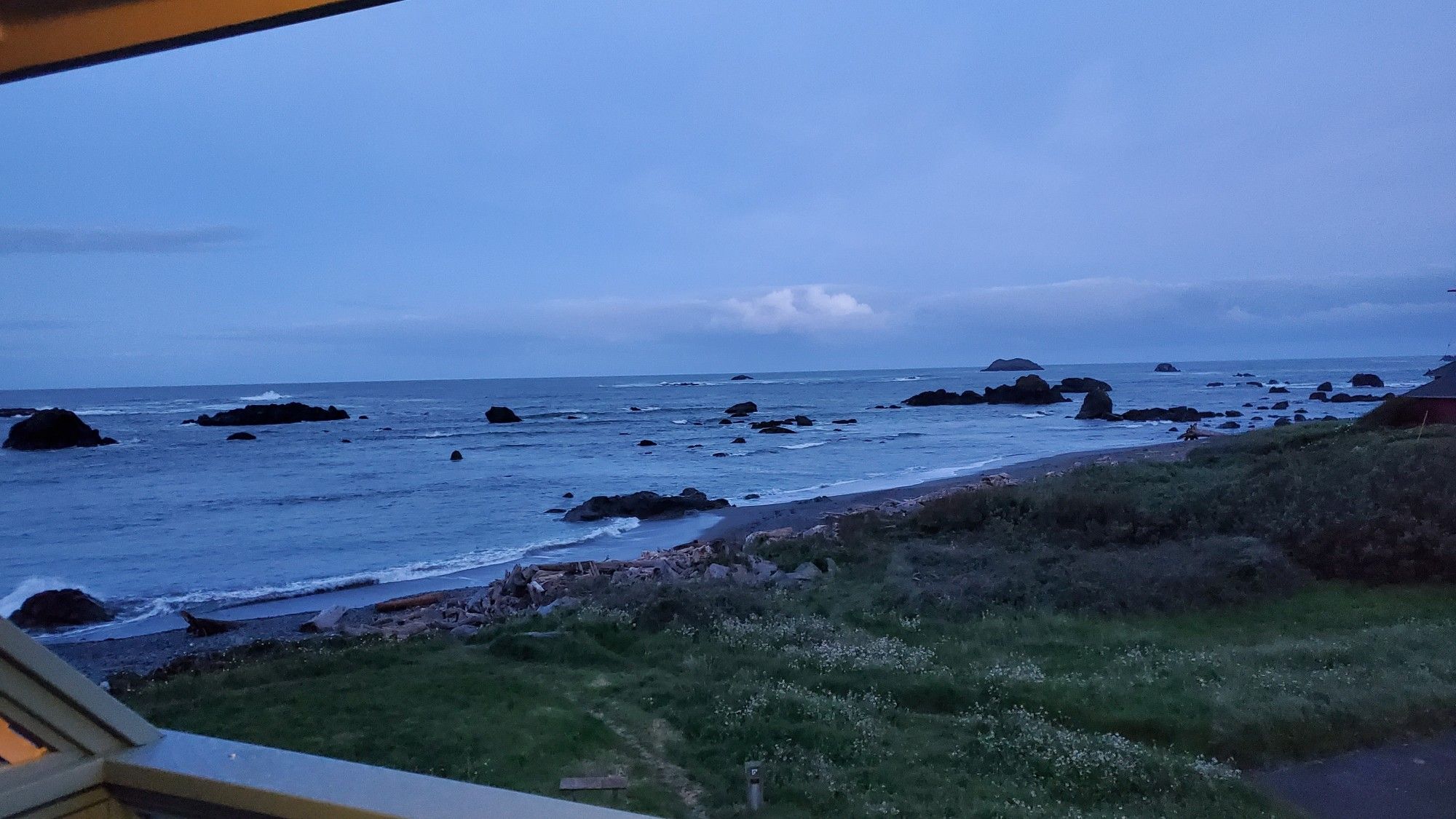 Photo of the ocean from the balcony of my hotel room in early morning pre-sunrise light.