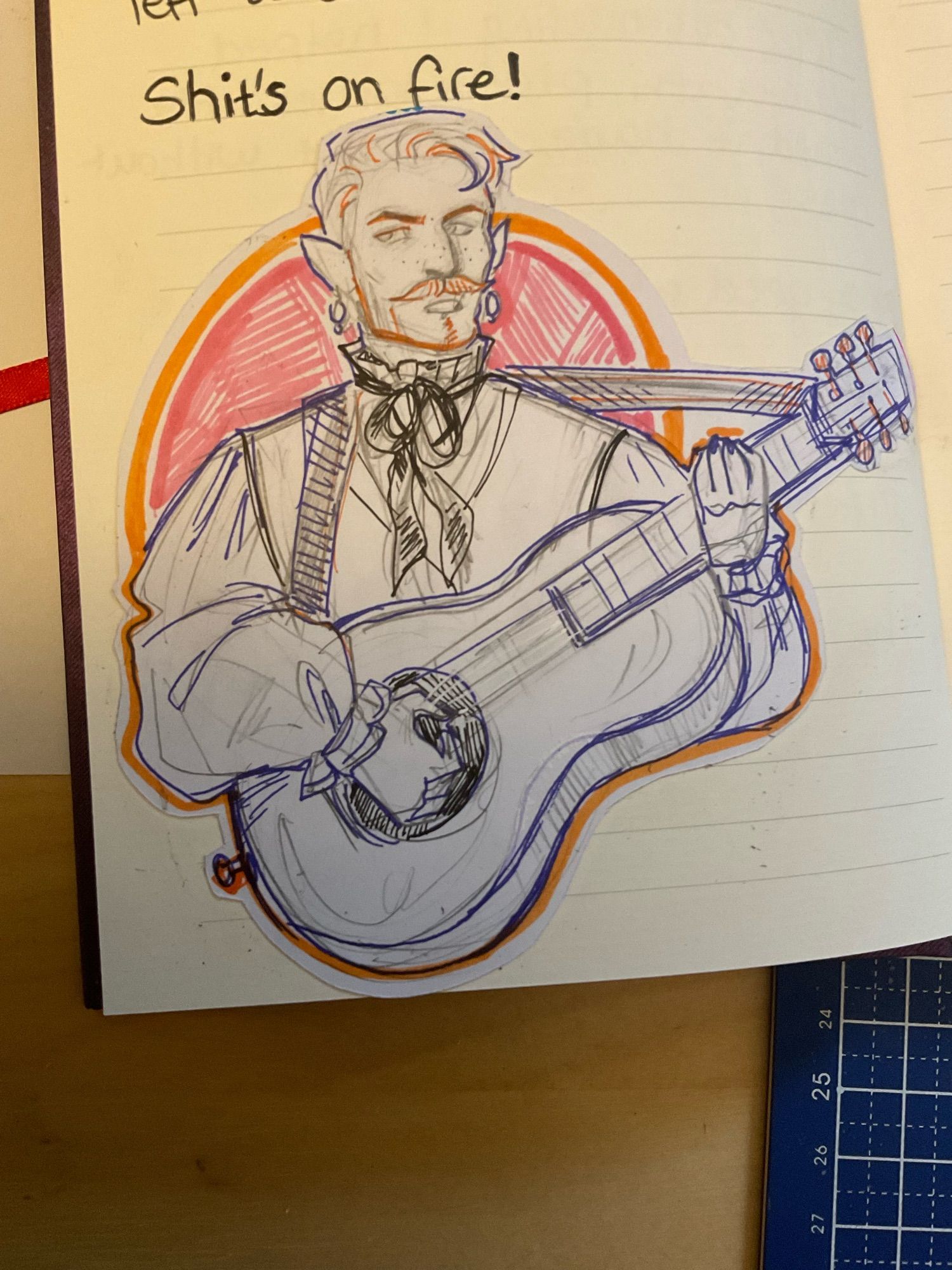 Doodle from my sketchbook of Adam playing his guitar. Text next to it says ‘shits on fire!’