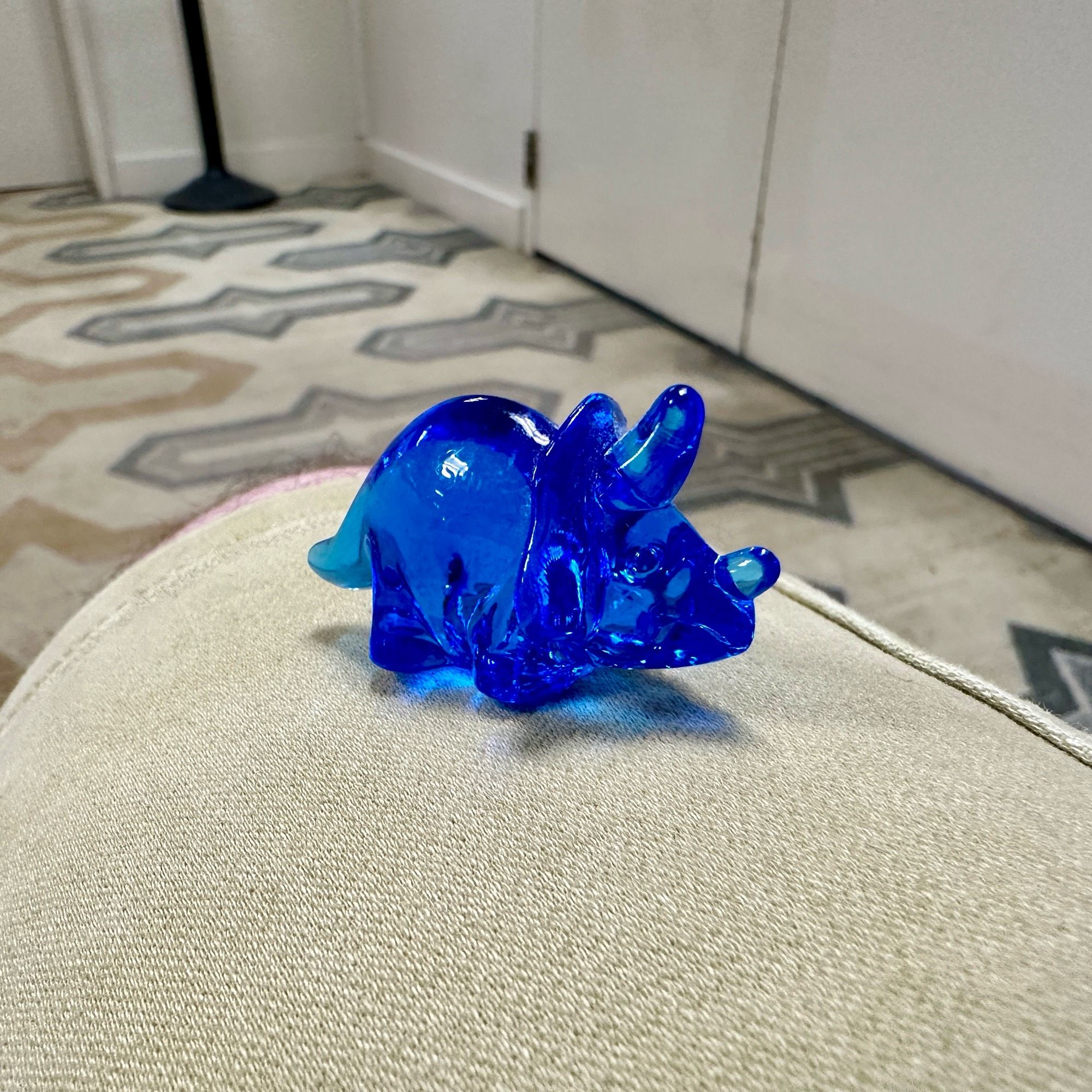 Adorable tiny blue dinosaur figure