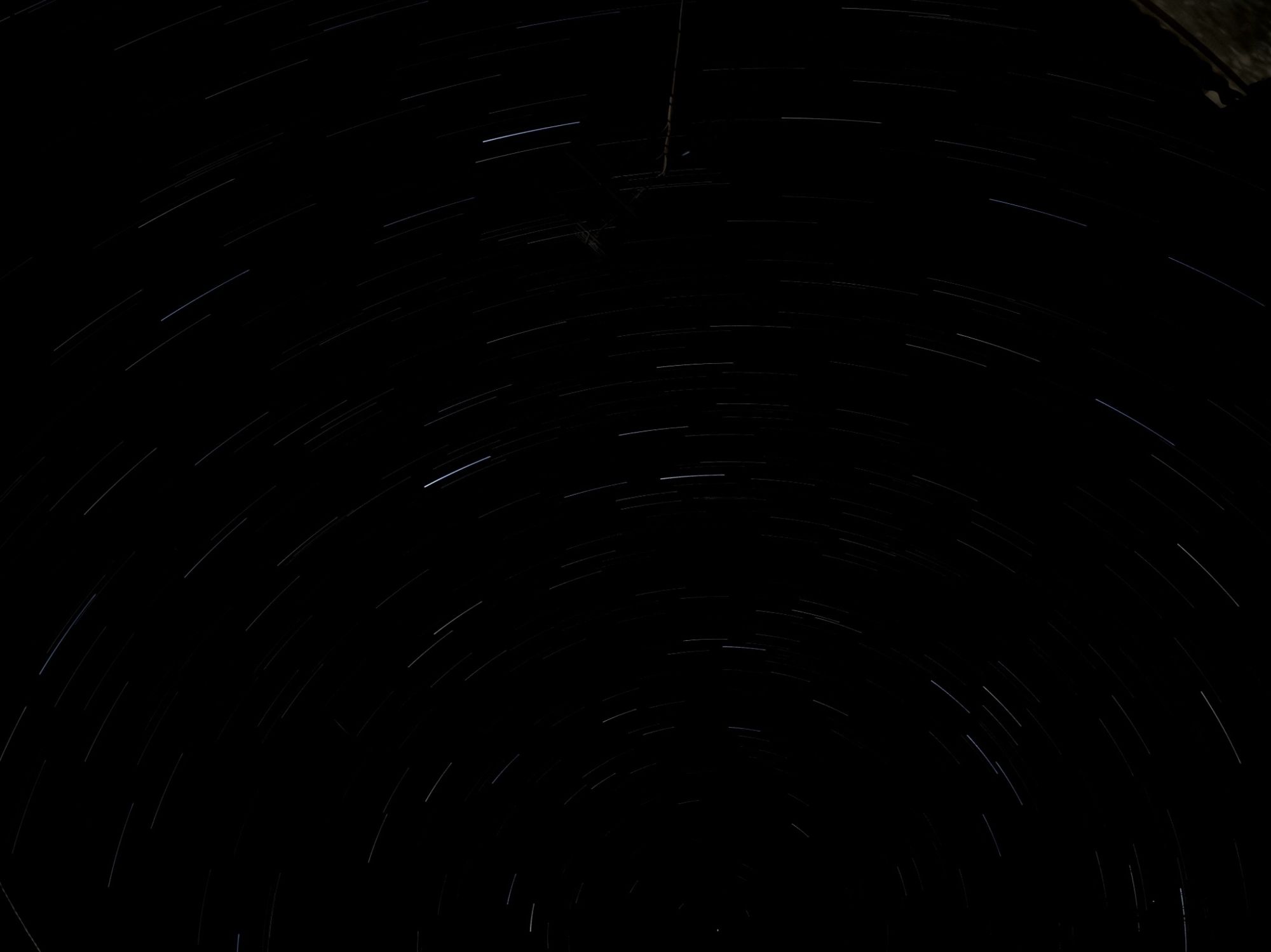 White star trails in the night sky