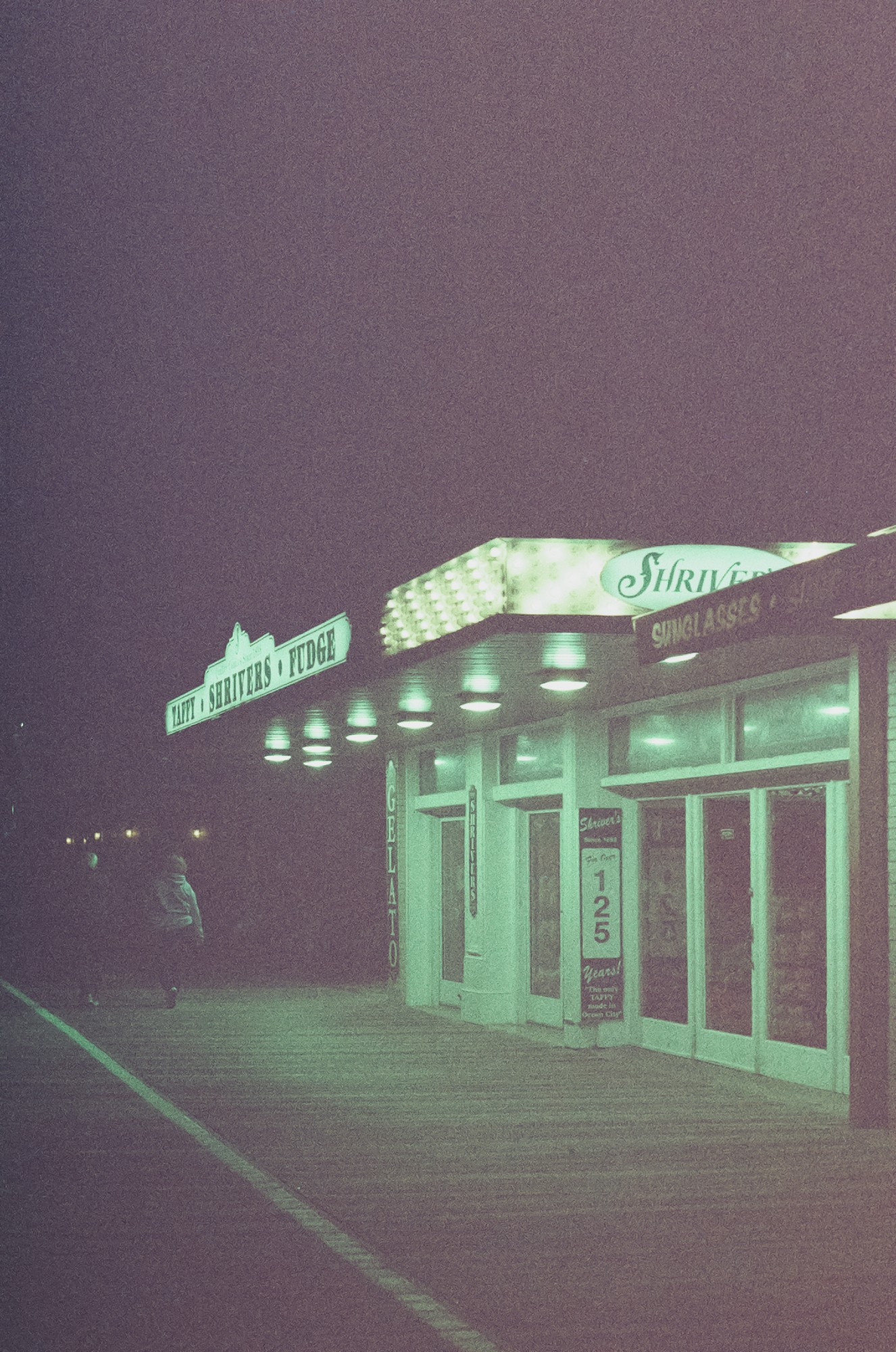 Shriver's, a candy shop on the Ocean City boardwalk, lit up in the dark.