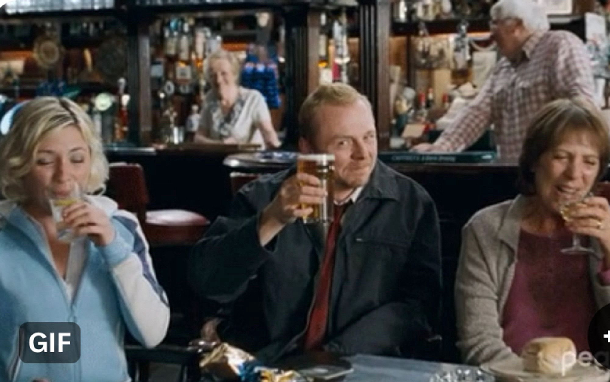 Simon Pegg raising a pint at the pub in Shawn of the Dead