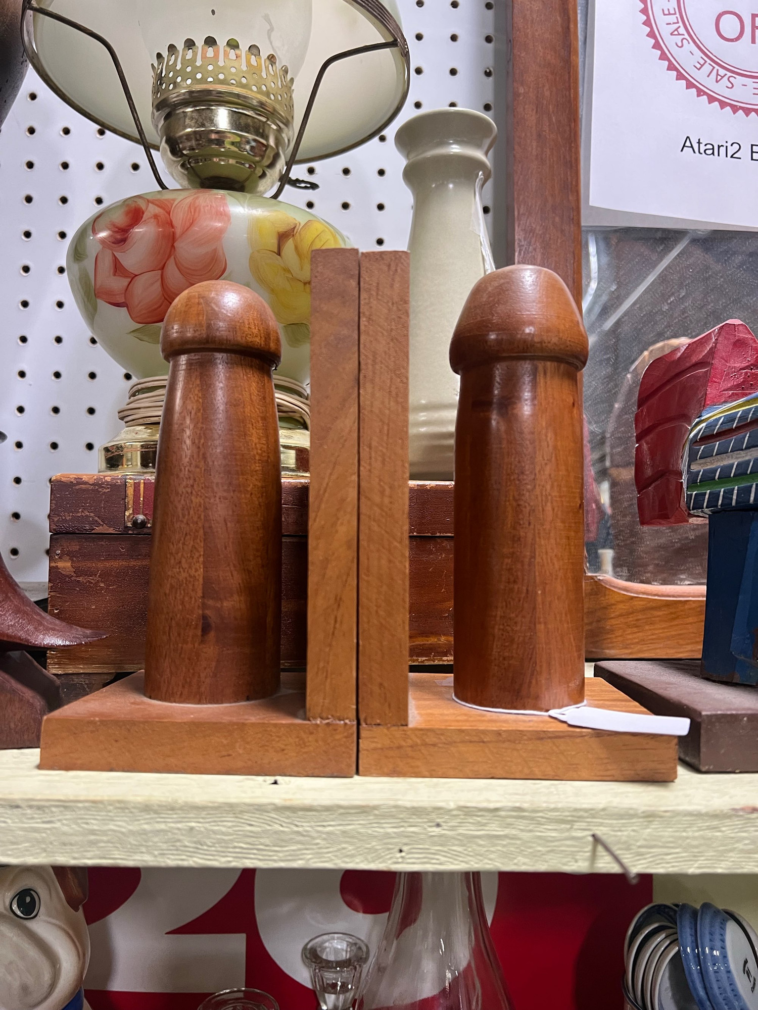 A set of wooden bookends that look like hand-turned, lovingly polished dildos